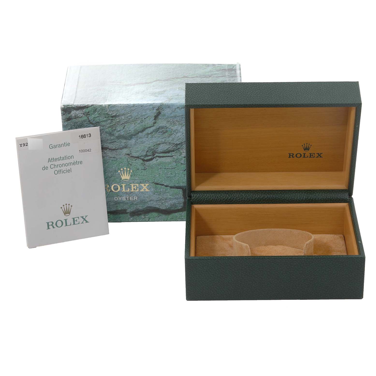 This image shows an open wooden Rolex box and certificate for the Submariner model, alongside its green exterior packaging.