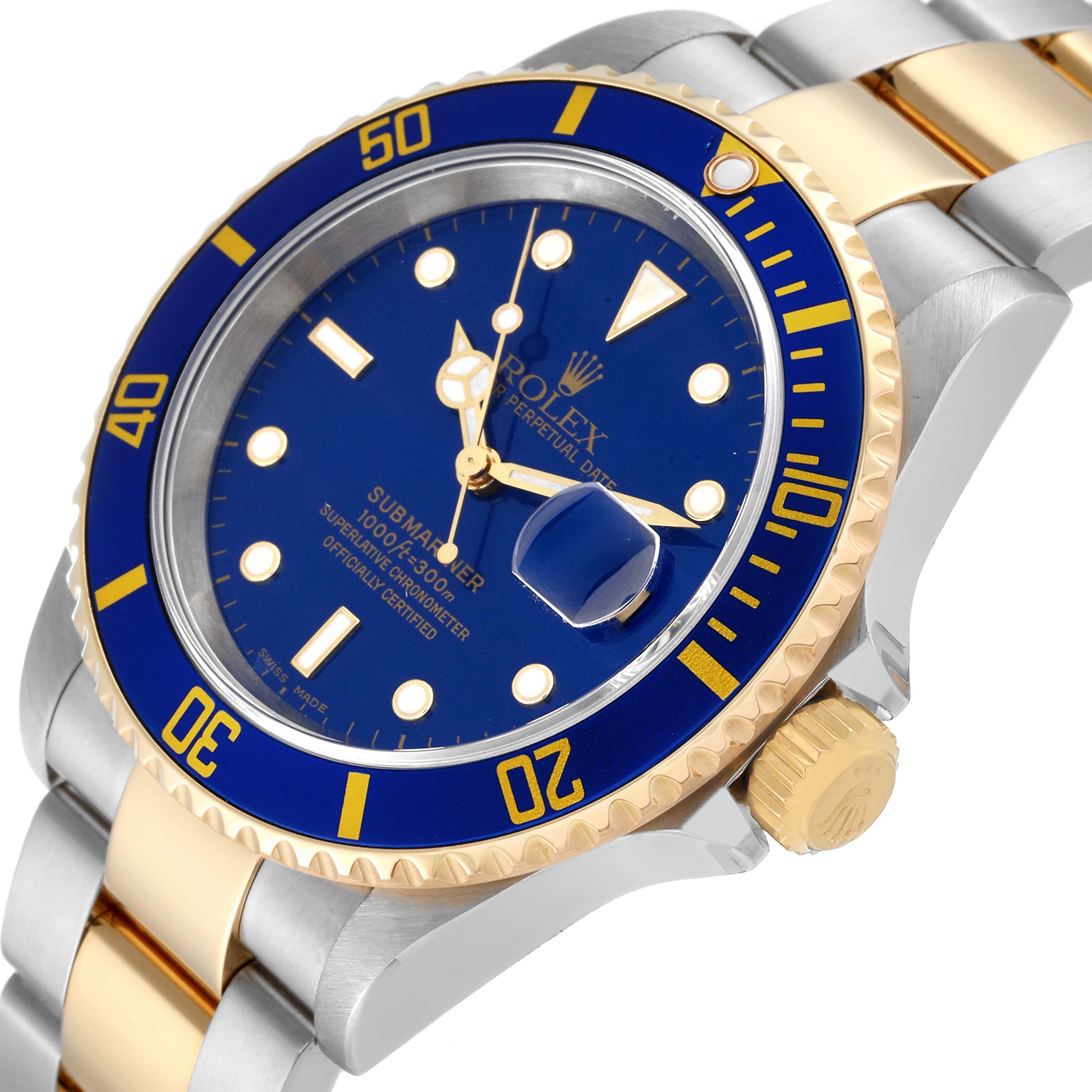 The image shows a close-up at an angle of a Rolex Submariner 16613 Men's Steel and Gold (two tone) Blue Dial 16613 Men's Steel and Gold (two tone) Blue Dial watch, focusing on the dial, bezel, crown, and part of the bracelet.