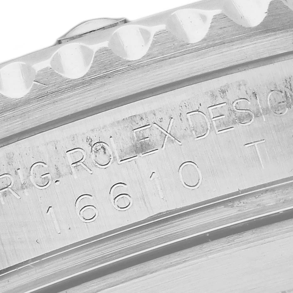 The image shows a close-up of the bezel and case edge engraving on a Rolex Submariner 16610T Men's Stainless Steel Black Dial 16610T Men's Stainless Steel Black Dial.