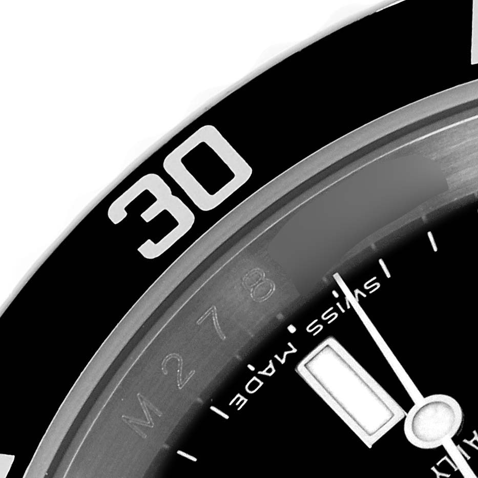 The image shows a close-up of the bezel and dial of a Rolex Submariner 16610T Men's Stainless Steel Black Dial 16610T Men's Stainless Steel Black Dial watch with the "30" minute marker visible.