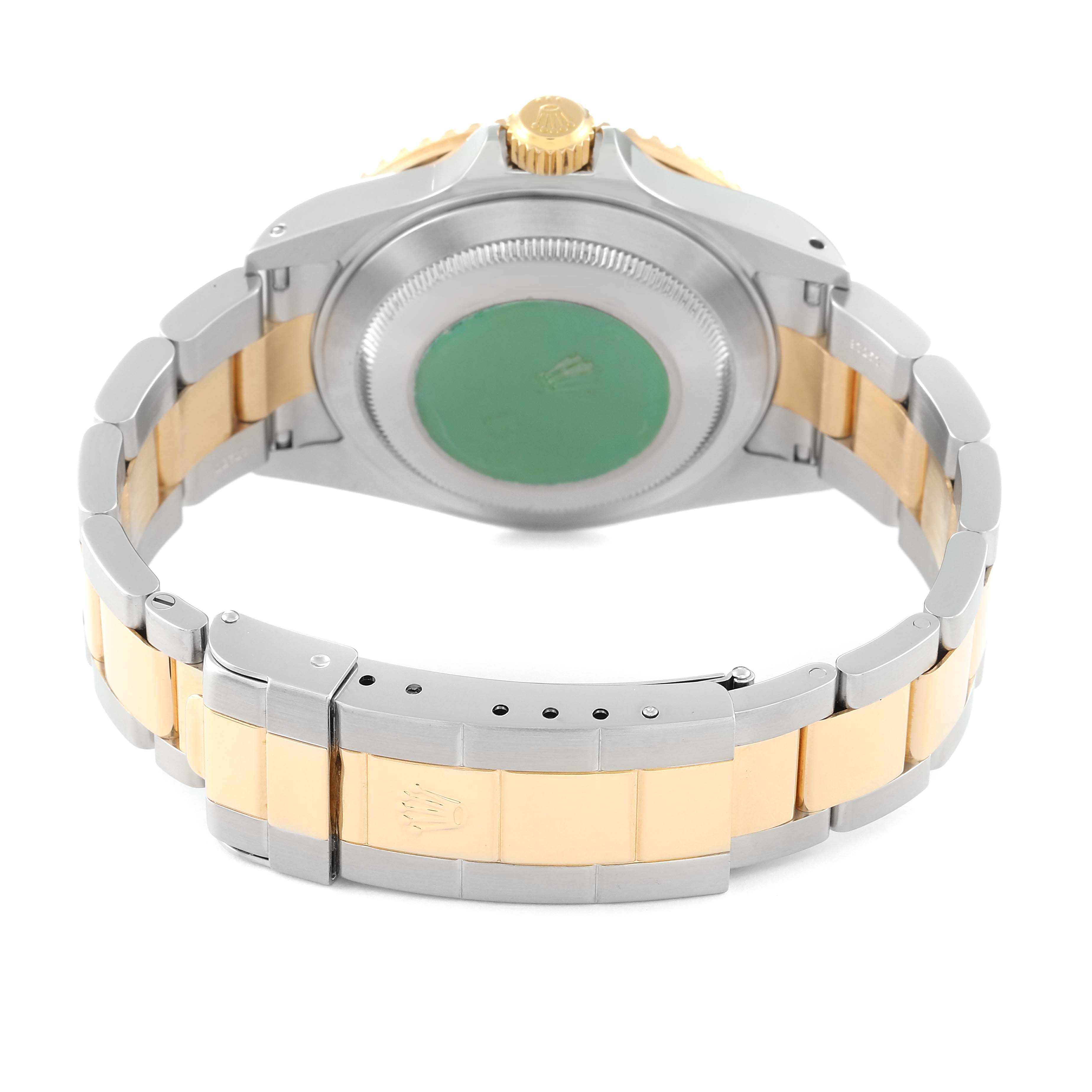 This image shows the back view of a Rolex Submariner 16613 Men's Steel and Gold (two tone) Black Dial 16613 Men's Steel and Gold (two tone) Black Dial watch, highlighting the case back, bracelet, and clasp.