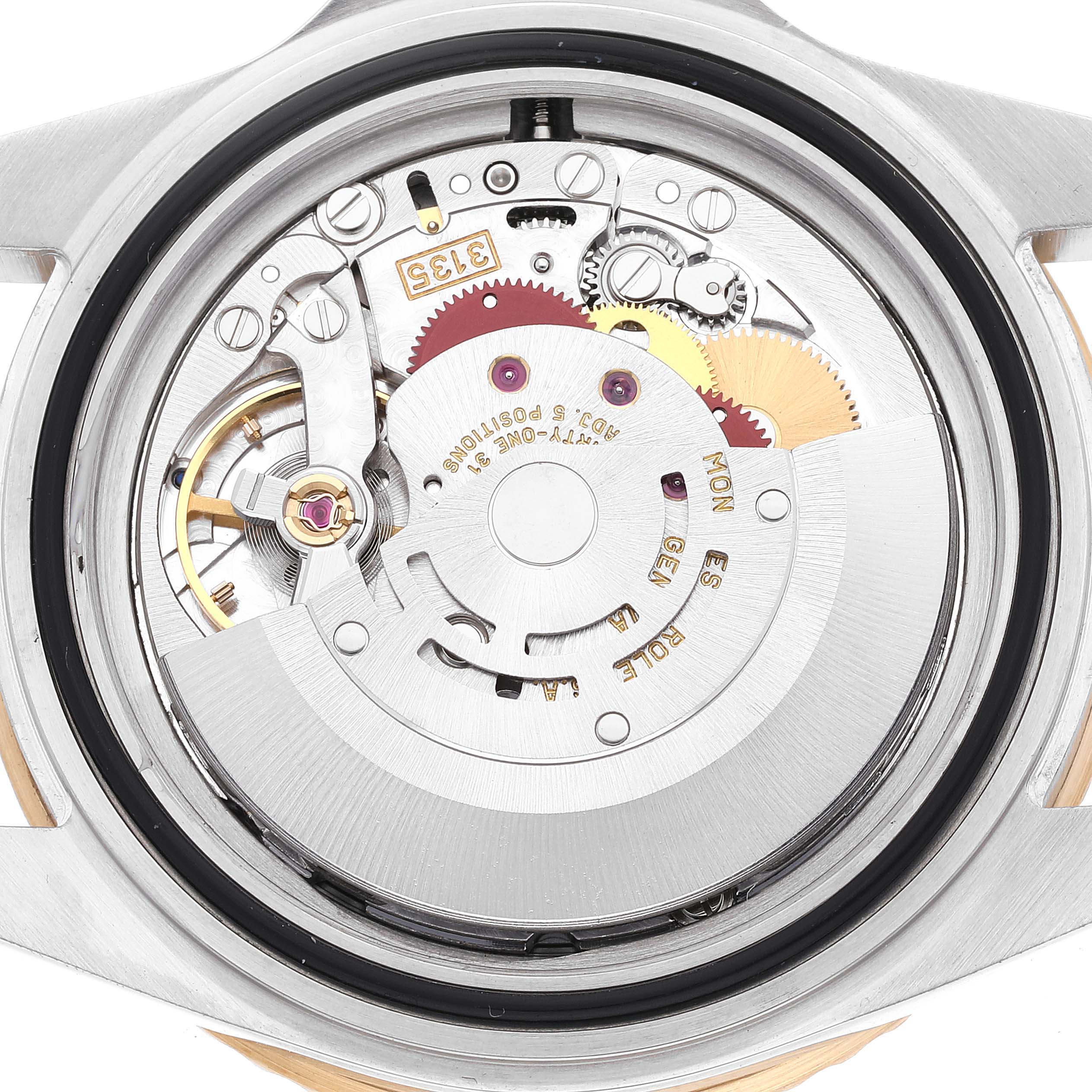 This image shows the internal mechanism and movement of a Rolex Submariner 16613 Men's Steel and Gold (two tone) Black Dial 16613 Men's Steel and Gold (two tone) Black Dial watch from a direct back view.