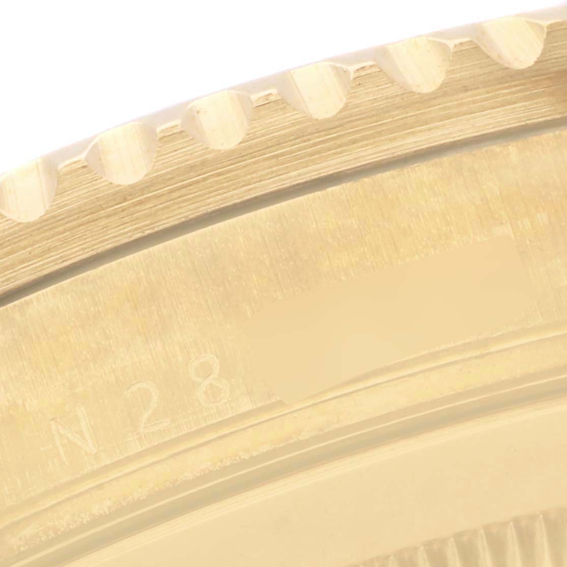 The image shows a detailed close-up of the bezel edge and case side of a Rolex Submariner 16618 Men's Yellow Gold Black Dial 16618 Men's Yellow Gold Black Dial watch.