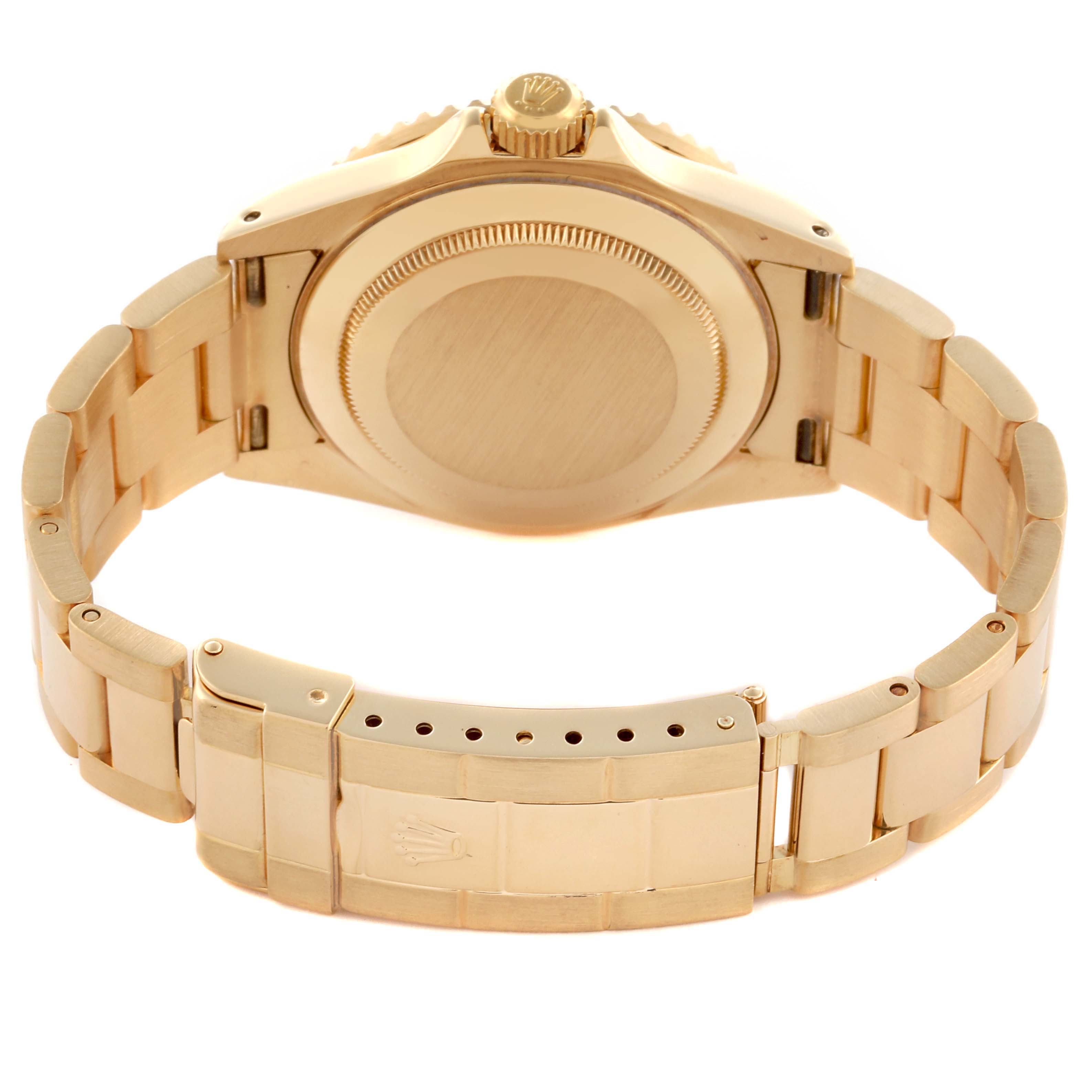 The image shows the back view of a Rolex Submariner 16618 Men's Yellow Gold Black Dial 16618 Men's Yellow Gold Black Dial, featuring its bracelet and closed clasp.