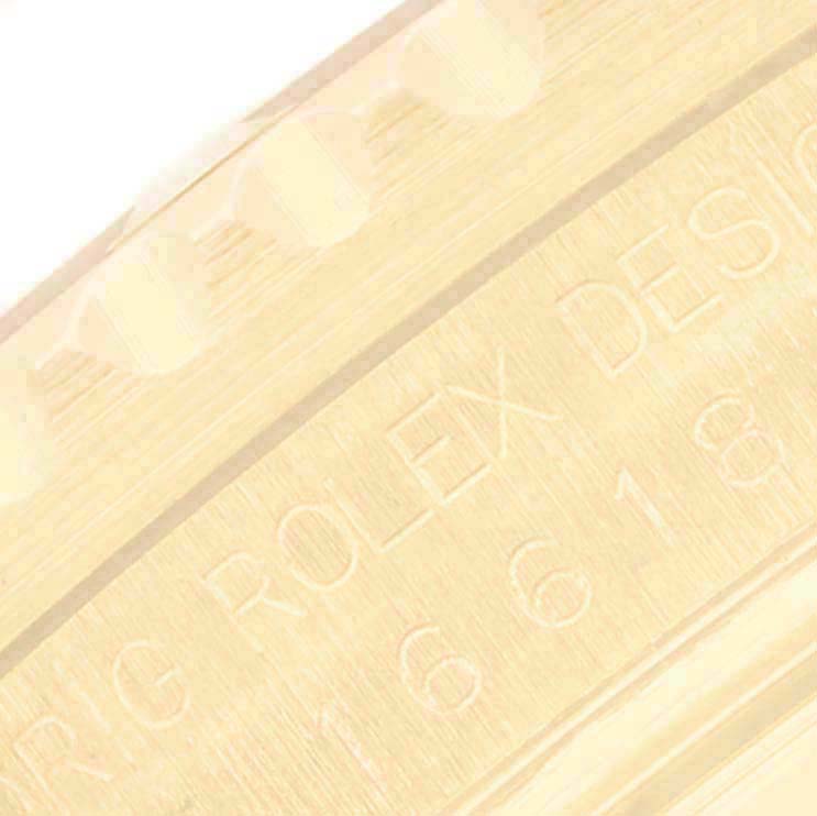 The image shows a close-up of the engraved side of a Rolex Submariner 16618 Men's Yellow Gold Blue Dial watch, focusing on the model number and text.
