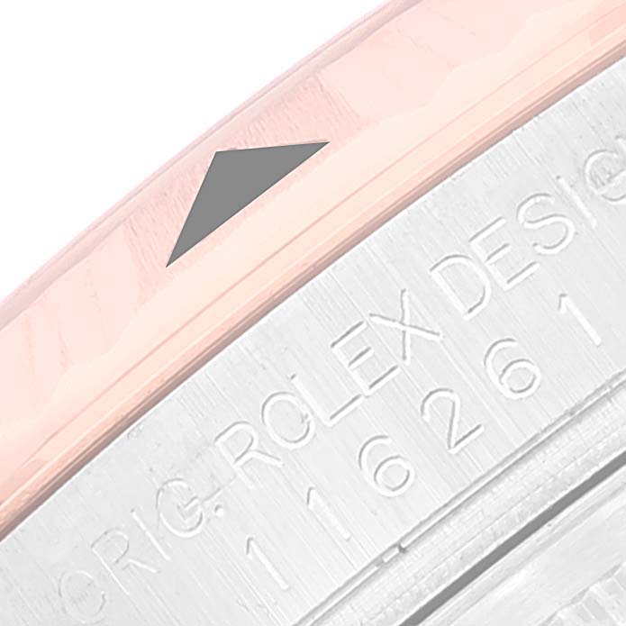 This image shows a close-up of the bezel and serial number engraving on a Rolex Turn-o-Graph 116261 Men's Steel and Gold (two tone) Black Dial 116261 Men's Steel and Gold (two tone) Black Dial watch.