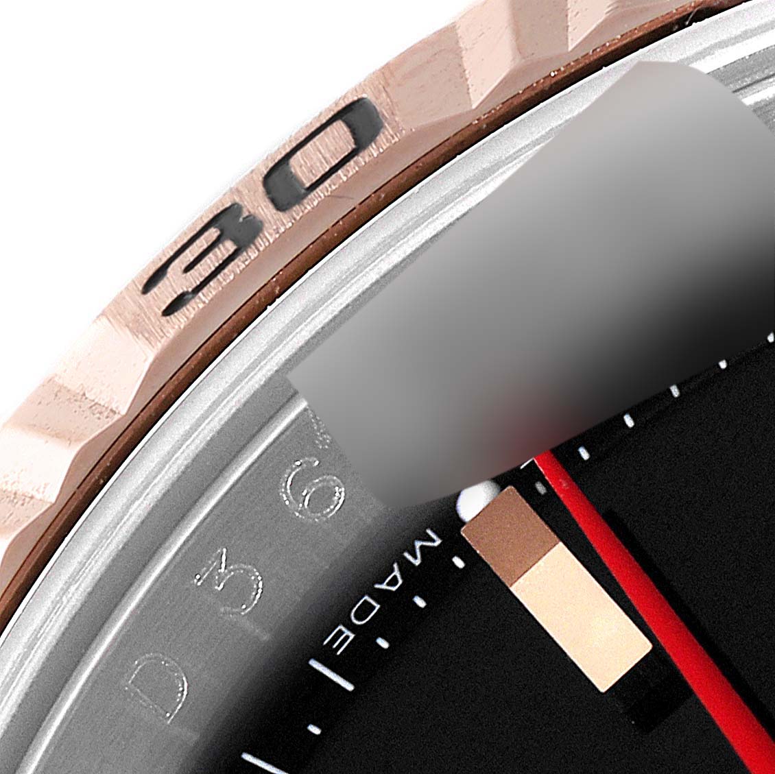 The image shows a close-up of the bezel and partially the dial of a Rolex Turn-o-Graph 116261 Men's Steel and Gold (two tone) Black Dial 116261 Men's Steel and Gold (two tone) Black Dial watch.