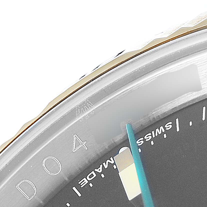 The image shows a close-up of the bezel and dial of a Rolex Turn-o-Graph 116263 Men's Steel and Gold (two tone) Black Dial 116263 Men's Steel and Gold (two tone) Black Dial watch, focusing on the "4" and "Swiss Made" text.