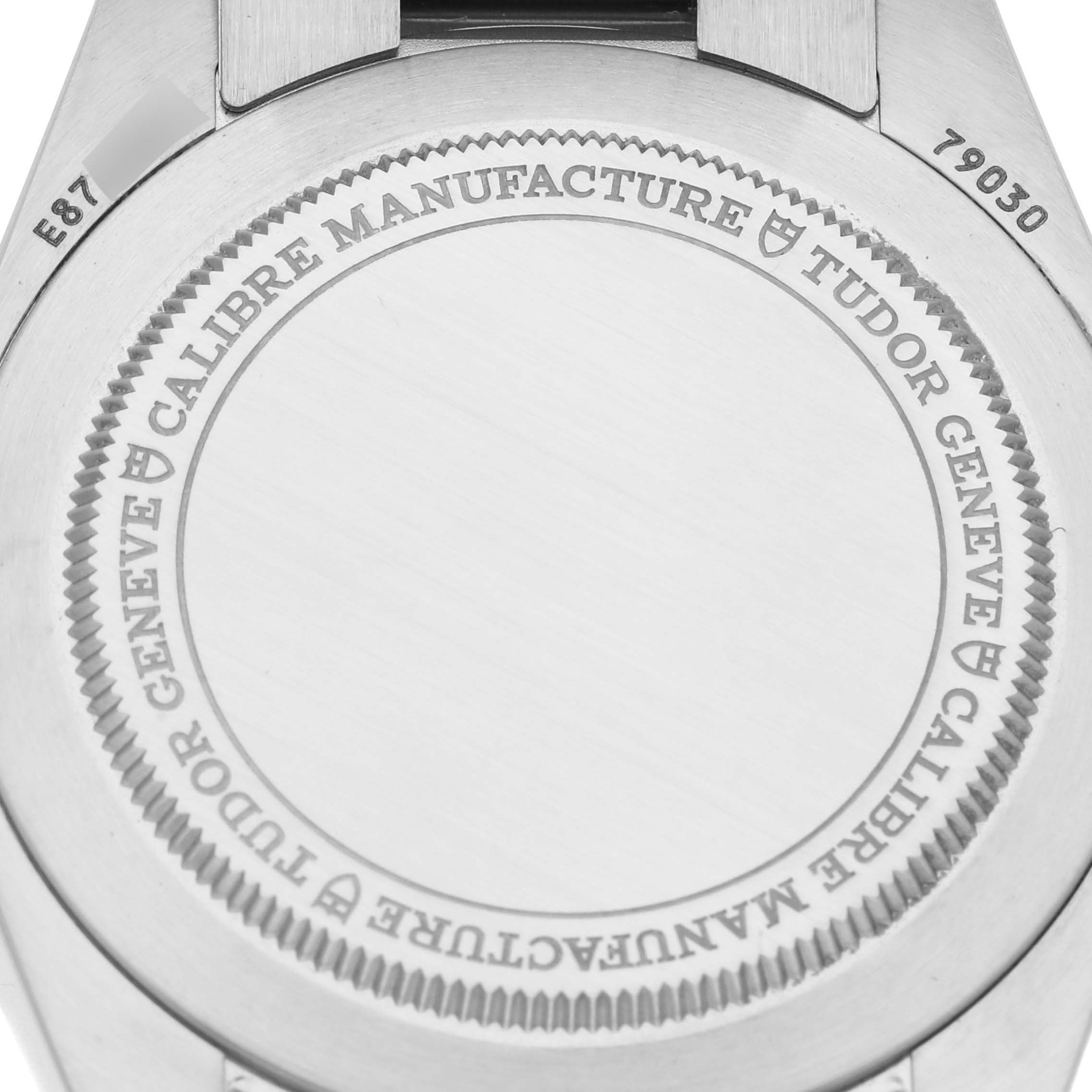 The image shows the case back of a Tudor Heritage Black Bay 79030N Men's Stainless Steel Black Dial 79030N Men's Stainless Steel Black Dial watch, including engraved details and serial numbers.