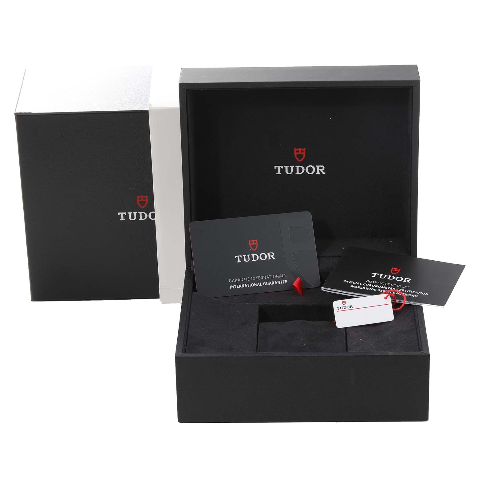 The image shows the open box and accessories, such as warranty cards, for the Tudor Heritage Black Bay M79470-0003 Men
s Stainless Steel Black Dial M79470-0003 Men
s Stainless Steel Black Dial model.