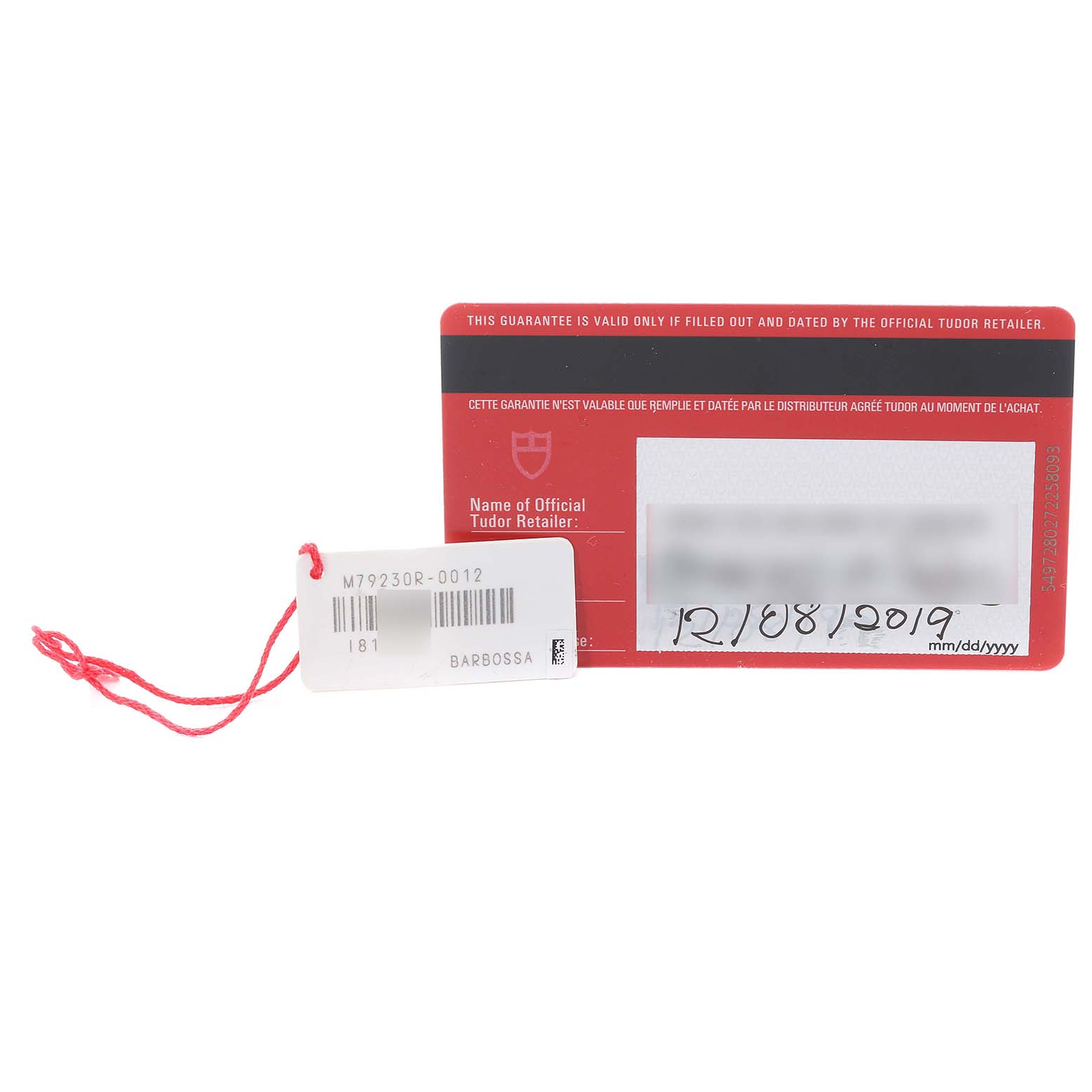 The image shows a warranty card and a tag for the Tudor Heritage Black Bay 79230R Men's Stainless Steel Black Dial 79230R Men's Stainless Steel Black Dial watch model.