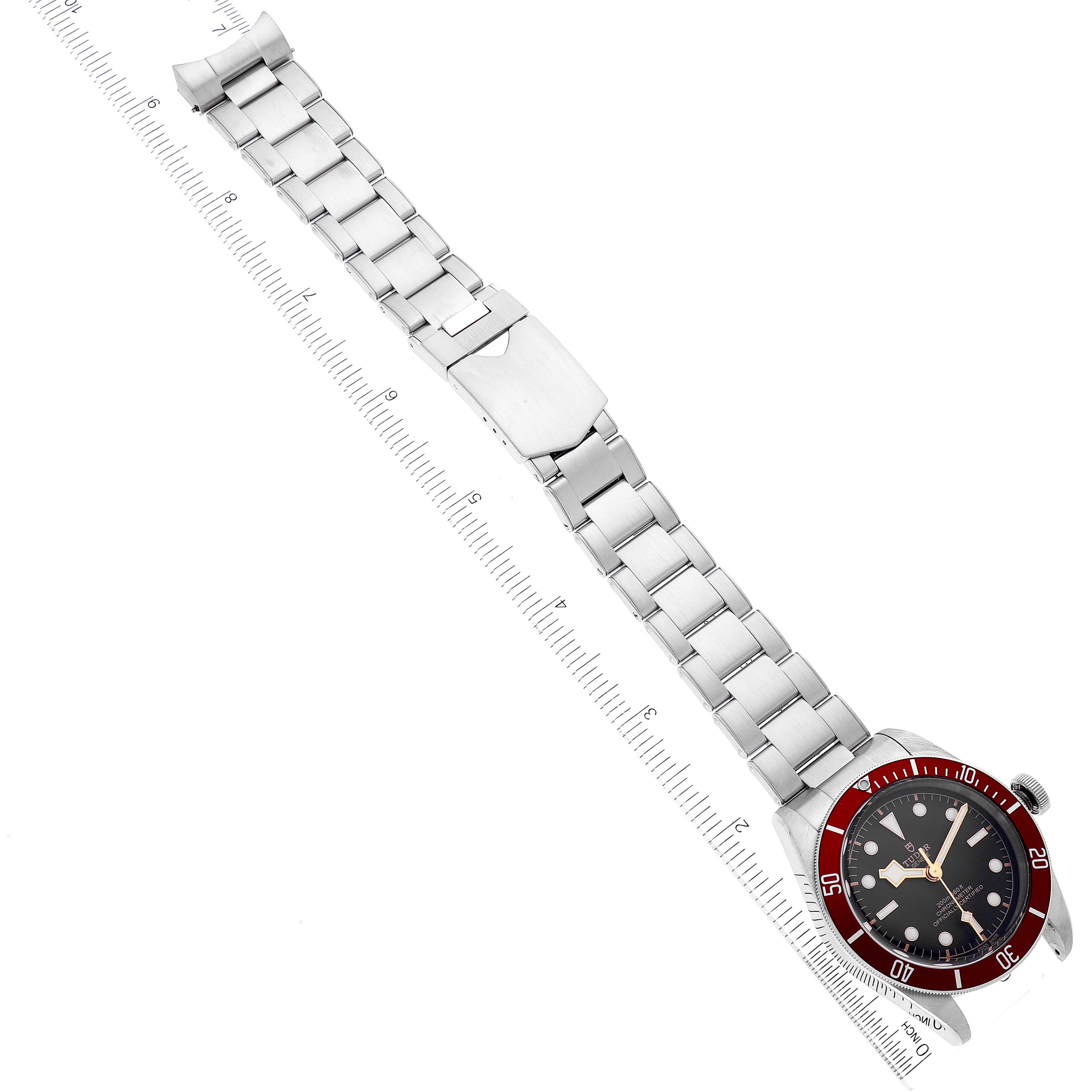 This image shows the full length of the Tudor Heritage Black Bay 79230R Men's Stainless Steel Black Dial 79230R Men's Stainless Steel Black Dial watch, from an overhead angle, including its face and metal bracelet.