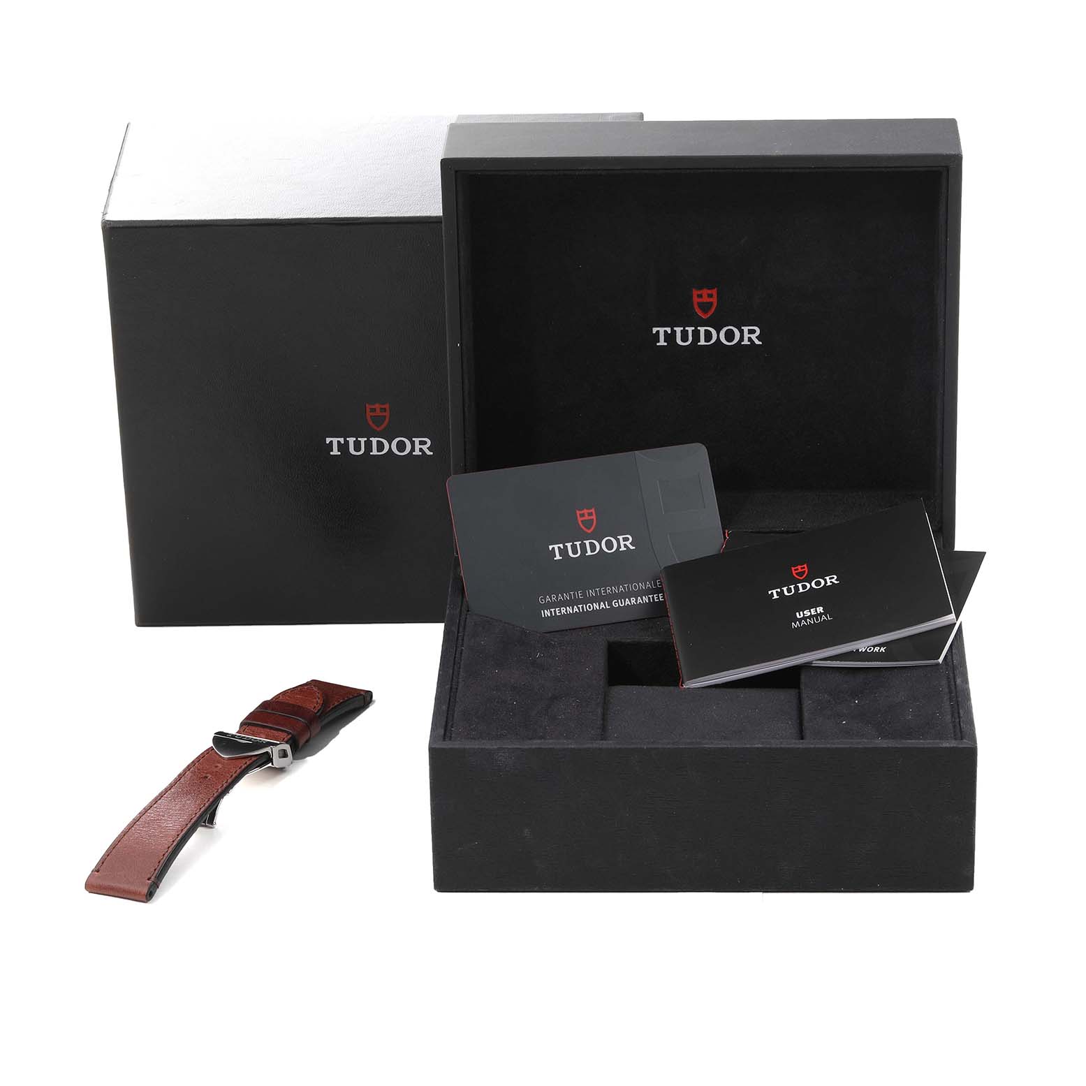 The image shows the packaging, user manual, warranty card, and an additional strap for a Tudor Heritage Black Bay 79830RB Men
s Stainless Steel Black Dial 79830RB Men
s Stainless Steel Black Dial watch.