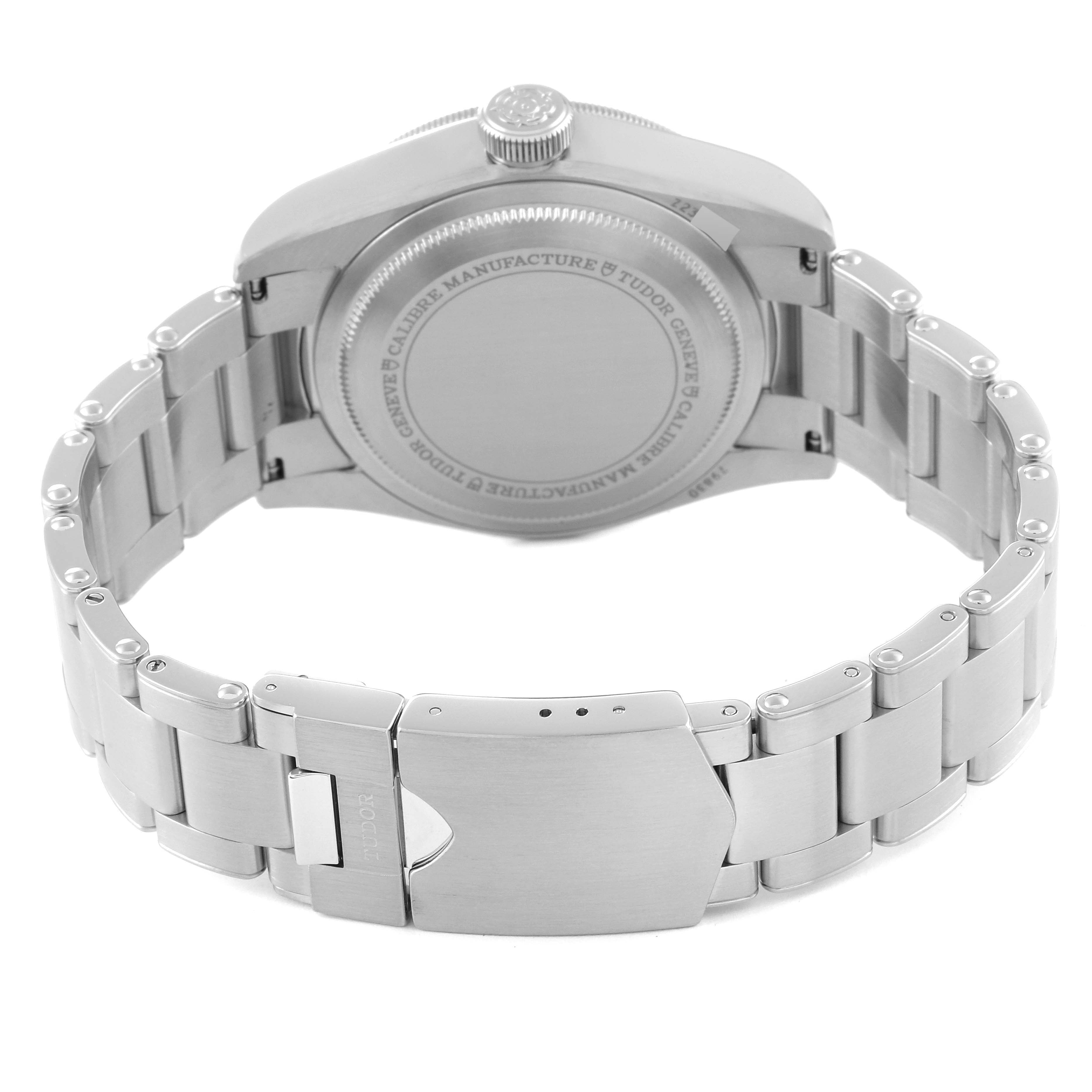 The image shows the back view of a Tudor Heritage Black Bay 79830RB Men
s Stainless Steel Black Dial 79830RB Men
s Stainless Steel Black Dial watch highlighting the closed clasp and stainless steel bracelet.