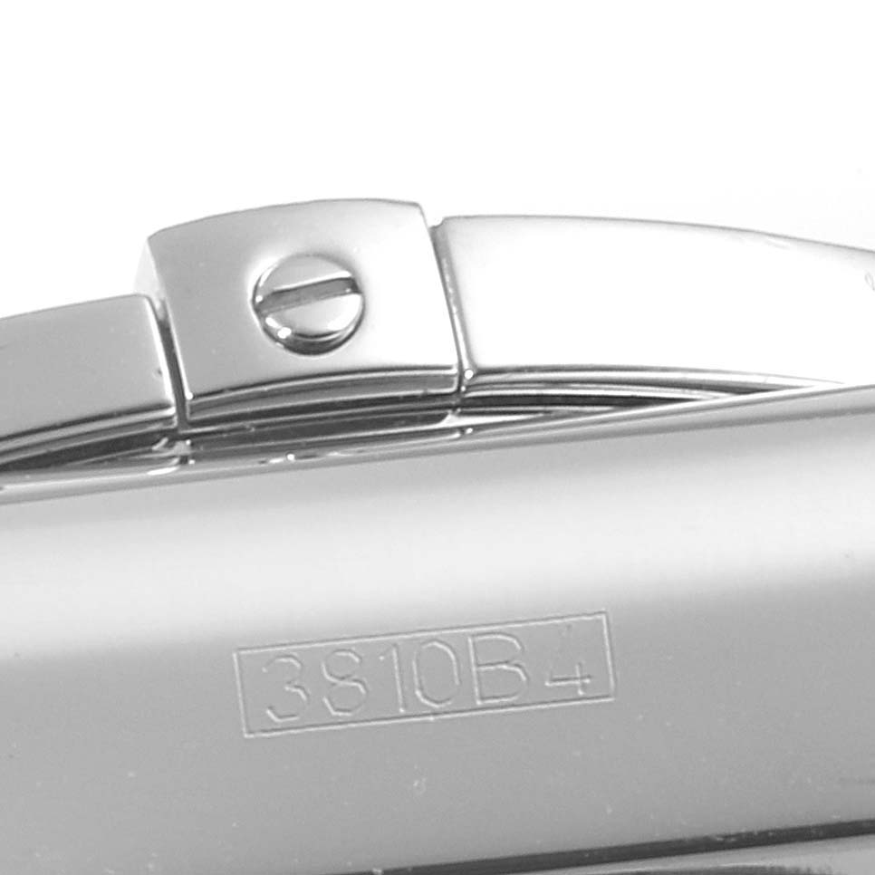 This close-up image shows a portion of the metallic bracelet clasp of a Breitling Chronomat AB0110 Men
s Stainless Steel Blue Dial AB0110 Men
s Stainless Steel Blue Dial watch.