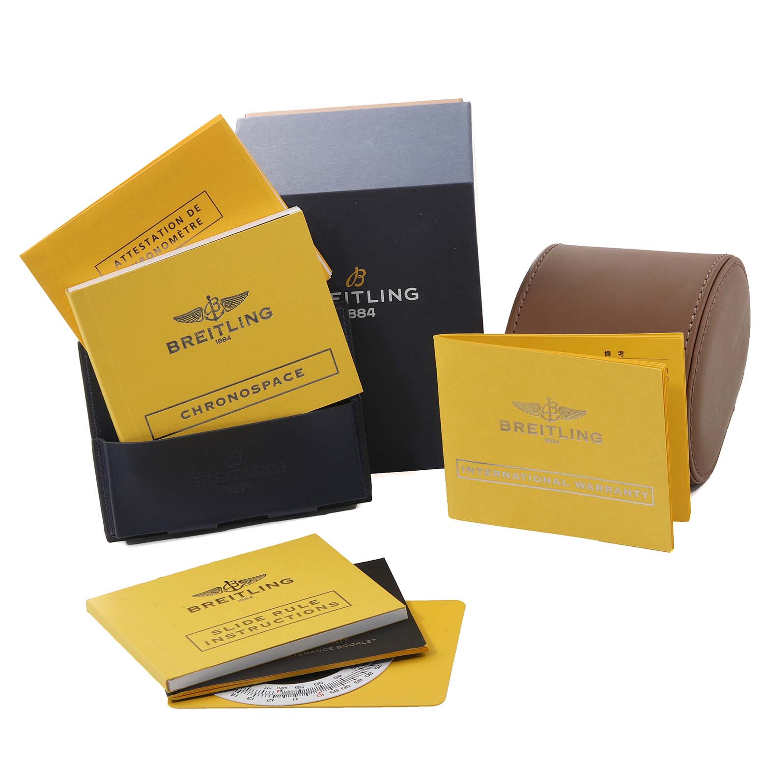 This image shows the Breitling Professional Series A78365 Men's Stainless Steel Silver Dial A78365 Men's Stainless Steel Silver Dial watch's accessories, including manuals, a warranty, and a watch case from an overhead angle.