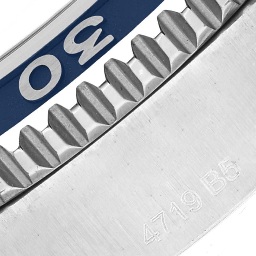 The image shows a close-up of the bezel and part of the case back of a Breitling Superocean A17366 Men's Stainless Steel White Dial A17366 Men's Stainless Steel White Dial watch.