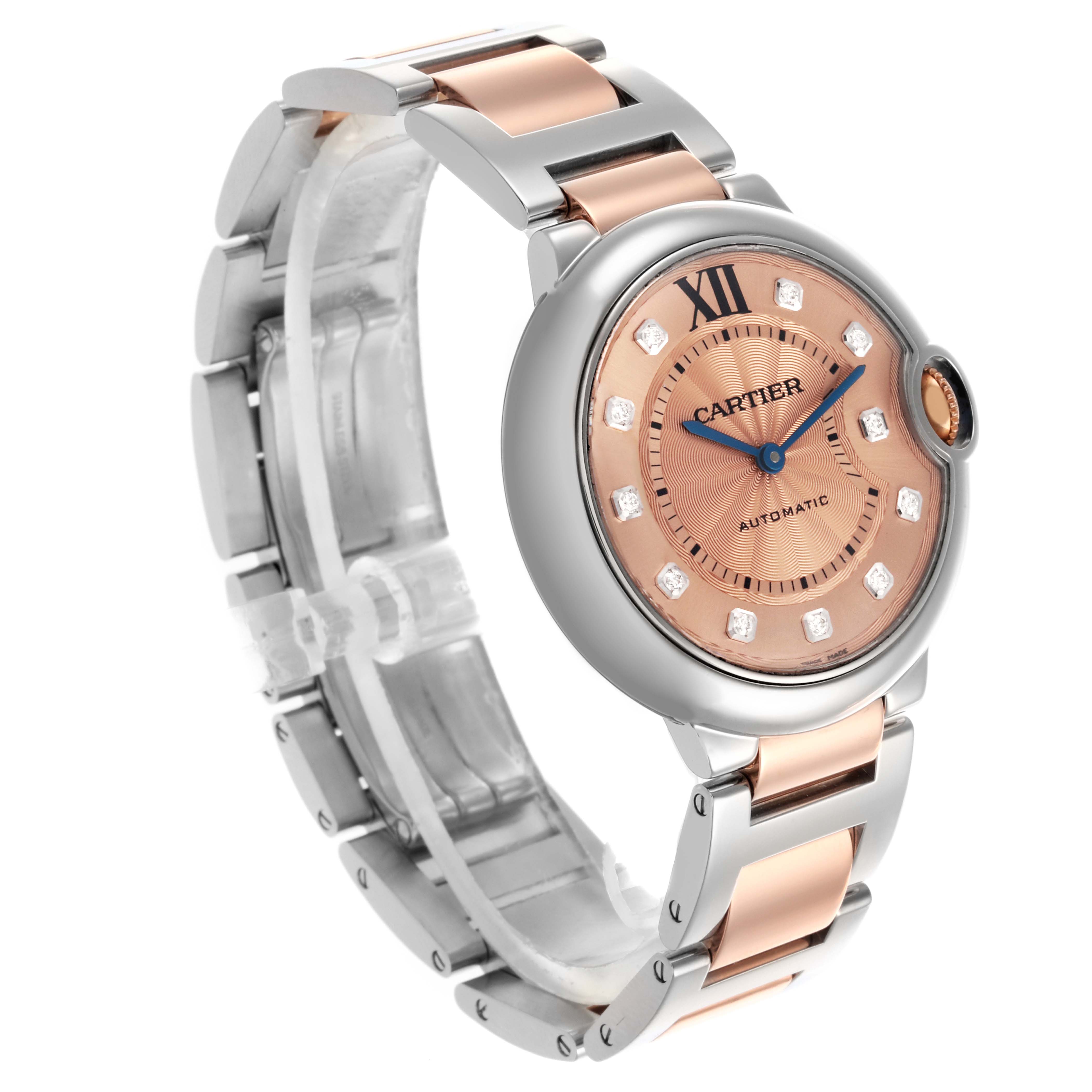 The Cartier Ballon Bleu WE902054 Women's Steel and Gold (two tone) Brown Dial WE902054 Women's Steel and Gold (two tone) Brown Dial watch is shown at an angle highlighting the rose gold dial, blue hands, and metal strap.
