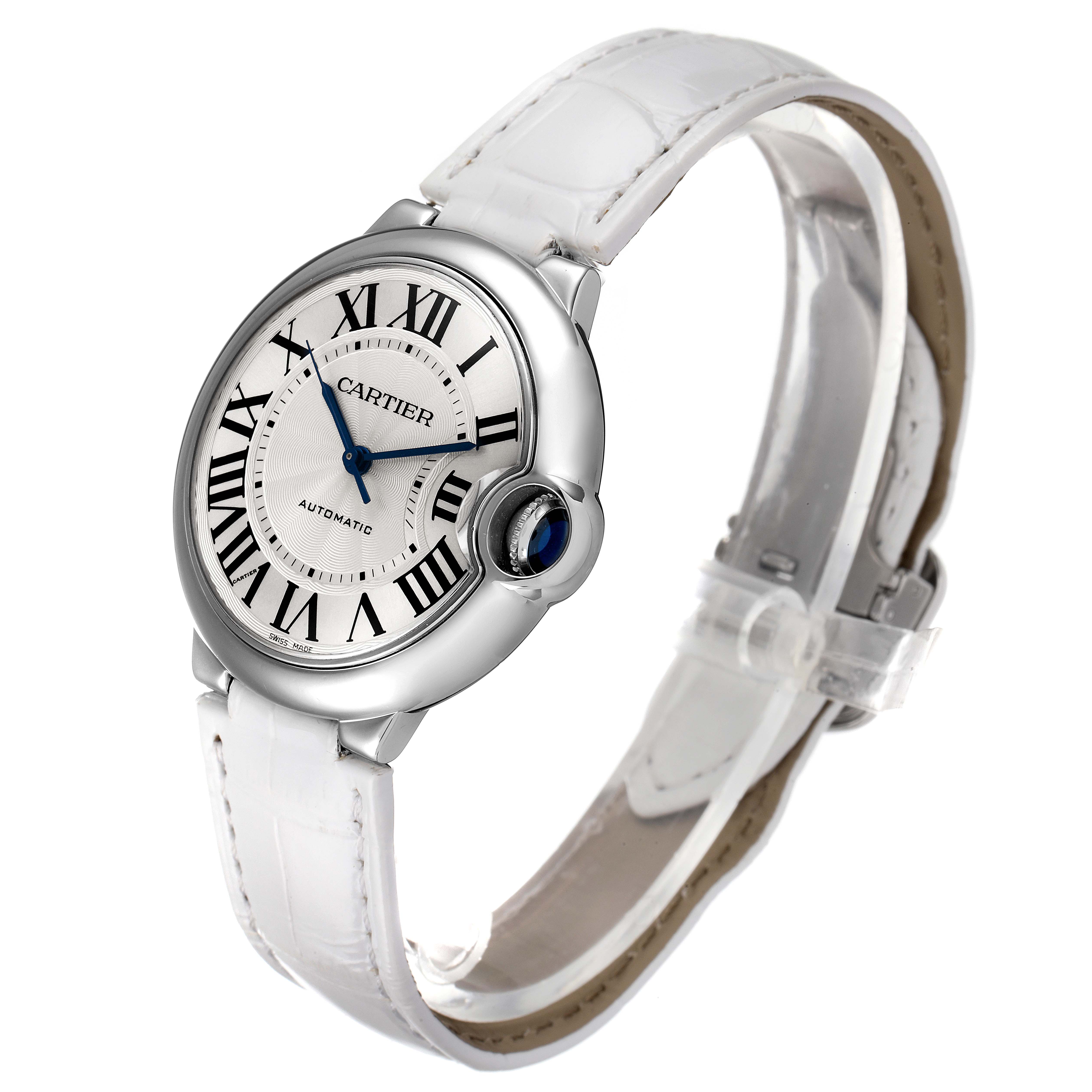 The image shows a side and partial top view of a Cartier Ballon Bleu W69017Z4 Men's Stainless Steel Silver Dial W69017Z4 Men's Stainless Steel Silver Dial watch featuring a white strap and blue cabochon crown.