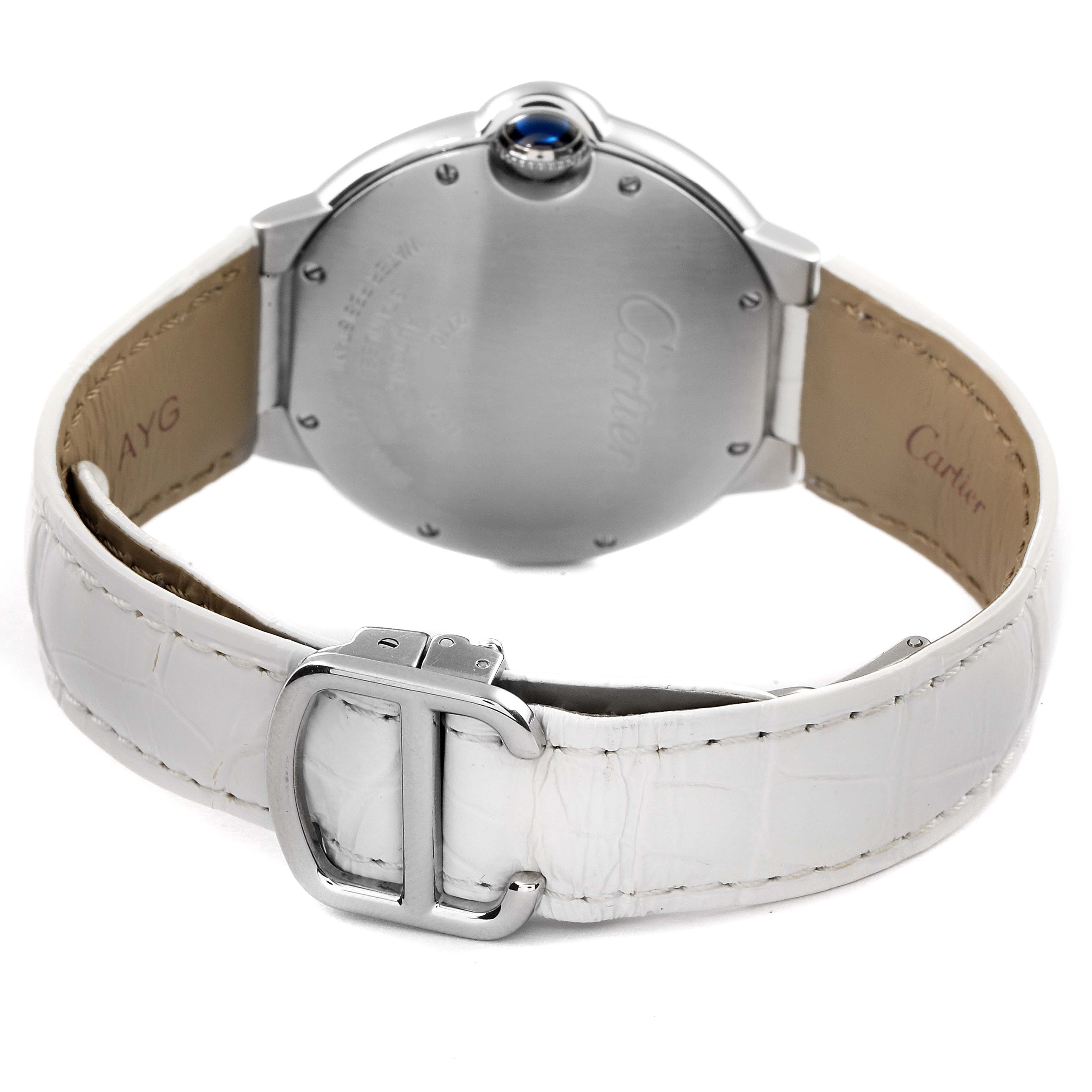 The image shows the back view of a Cartier Ballon Bleu W69017Z4 Men's Stainless Steel Silver Dial W69017Z4 Men's Stainless Steel Silver Dial watch, highlighting its case back, crown, and white leather strap with buckle.