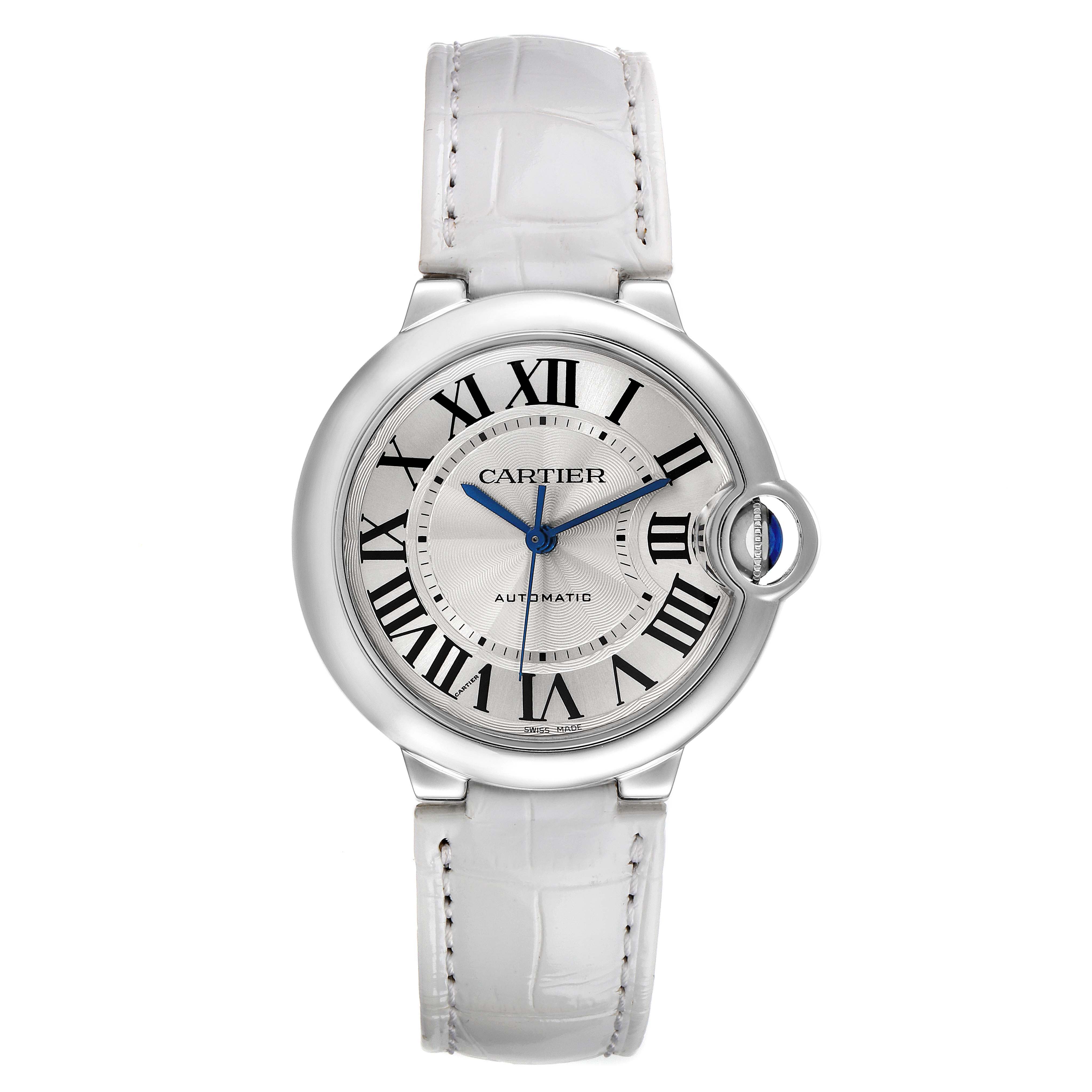 The image shows a front view of the Ballon Bleu by Cartier, displaying its dial, white leather strap, and distinctive blue hands.