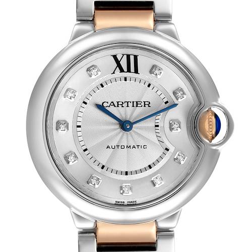 The Cartier Ballon Bleu watch is shown from a front angle, highlighting the dial, Roman numeral marker, and cabochon crown.