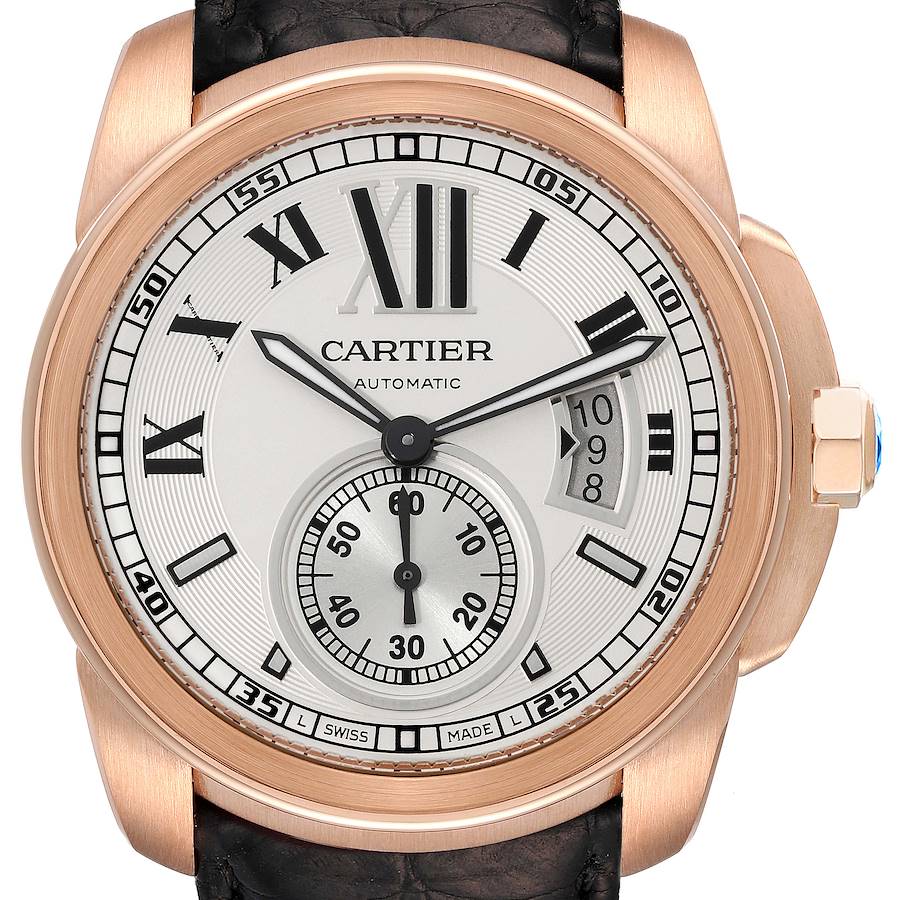 The Calibre de Cartier watch is shown from the front, displaying the face, hands, sub-dial, and crown.