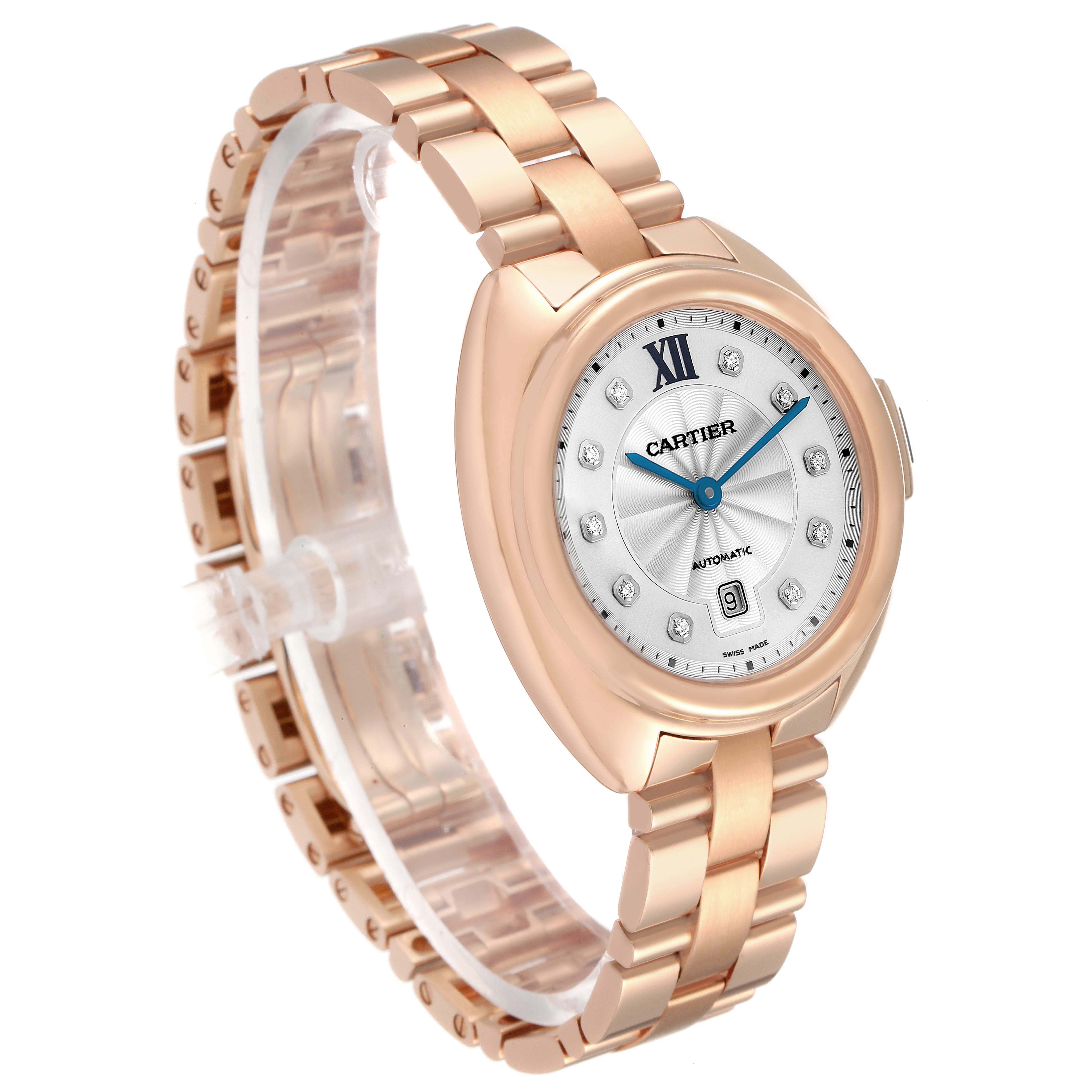 The Cartier Clé watch is shown at a slight angle, highlighting its face, bracelet, and side crown.