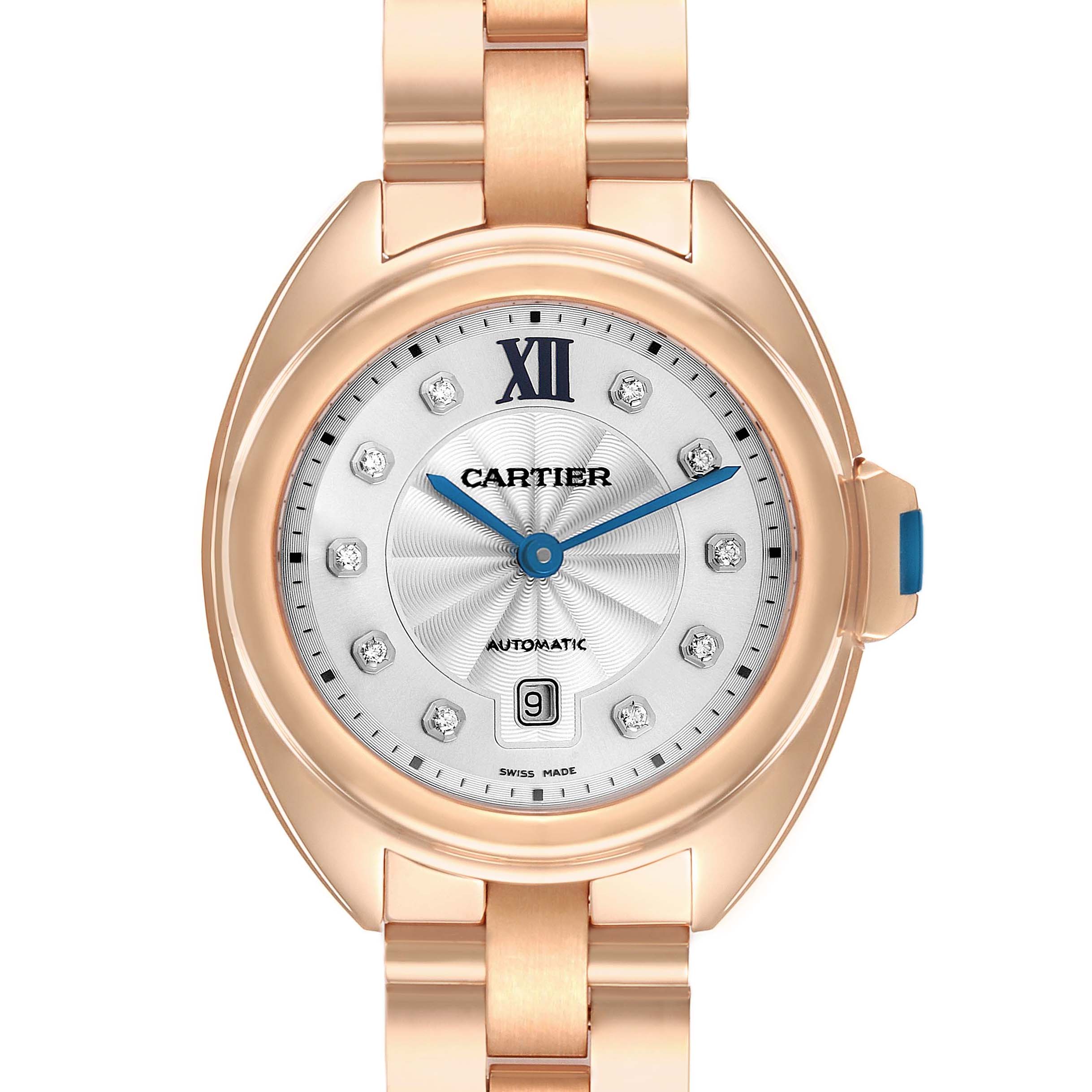 The Cartier Clé watch is shown from the front, highlighting the dial, case, and part of the bracelet.