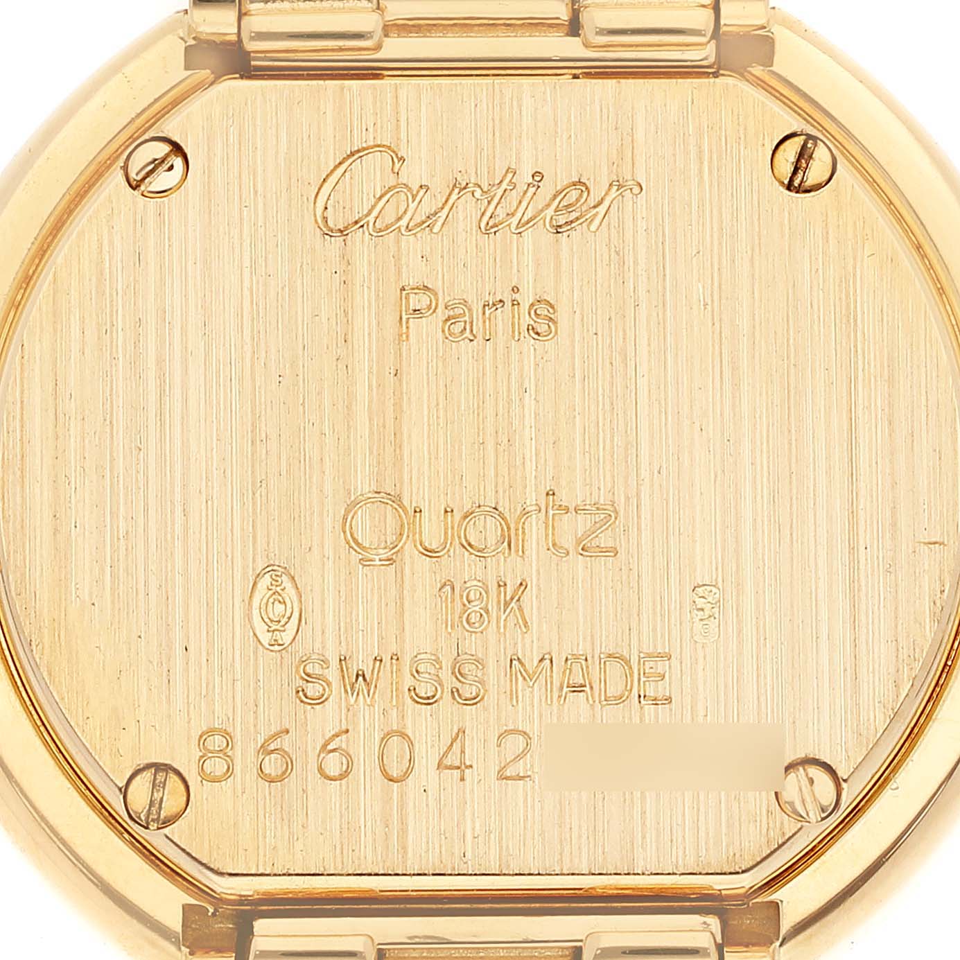 The image shows the back case of a Colisee model watch by Cartier, showcasing branding, material, and serial number.