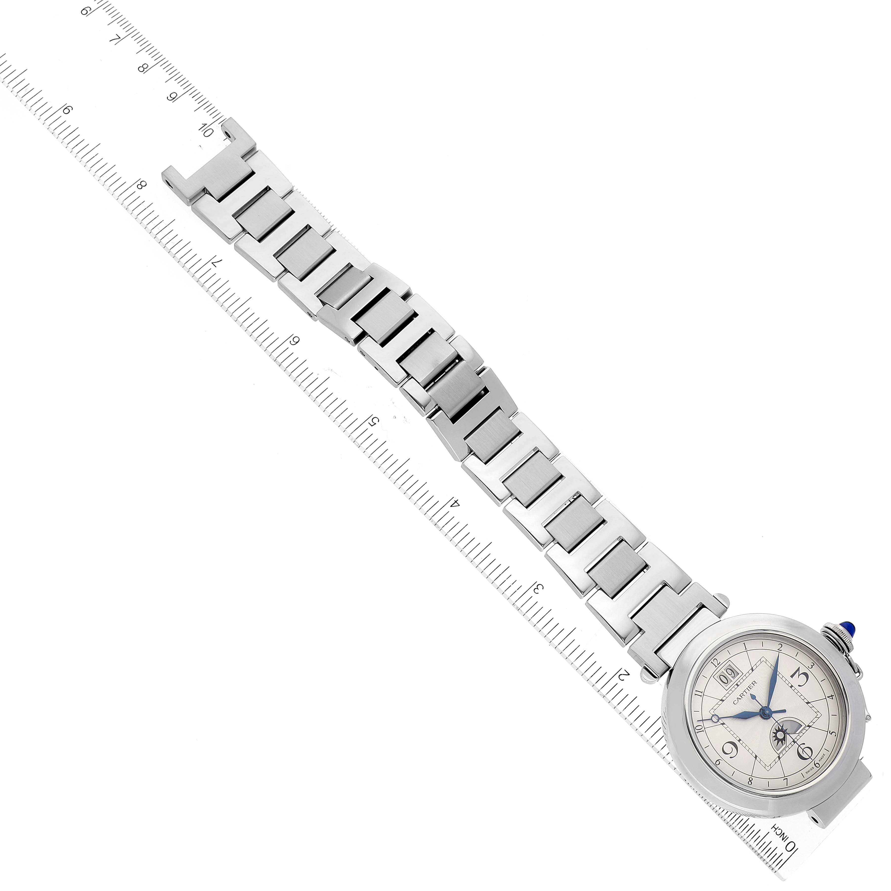 The image shows the full length of a Cartier Pasha W31093M7 Men's Stainless Steel Silver Dial W31093M7 Men's Stainless Steel Silver Dial watch, including its face and metal bracelet, aligned against a ruler.