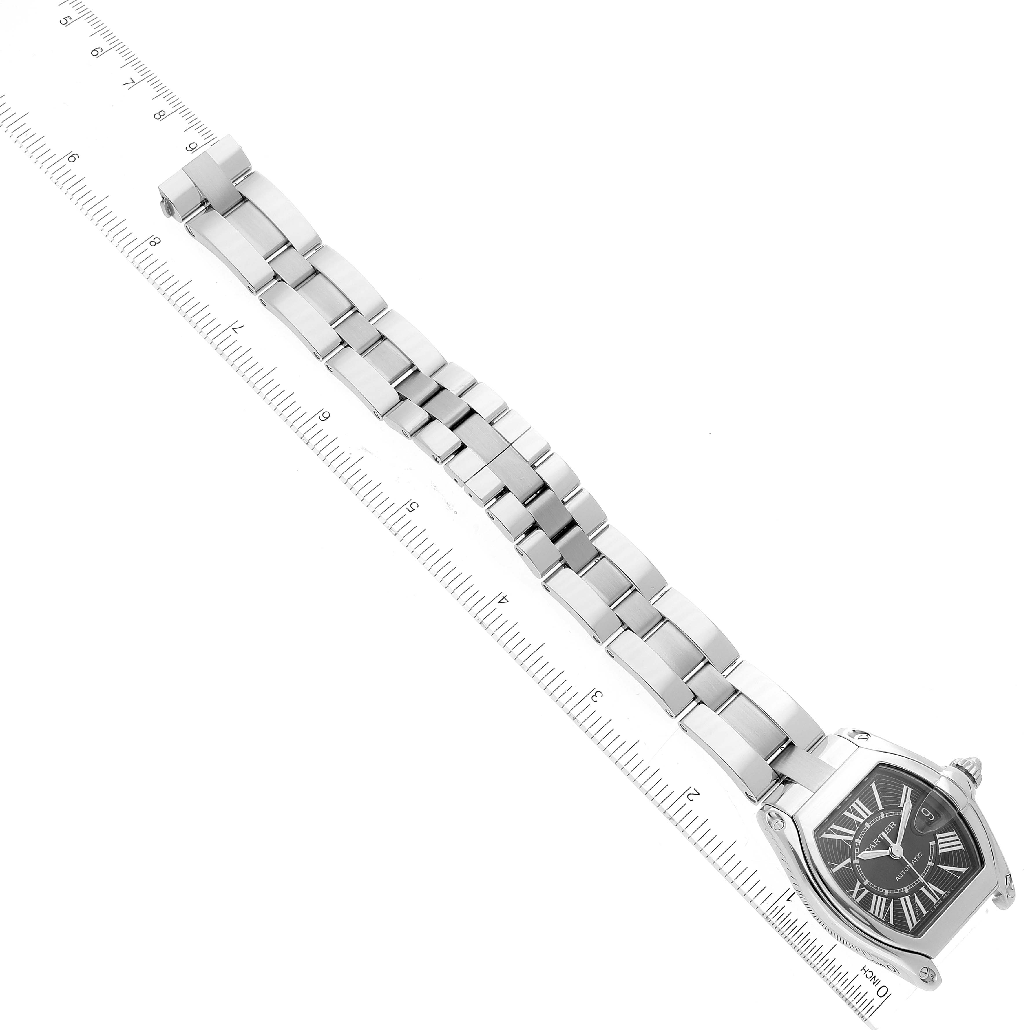 This Cartier Roadster W62041V3 Men
s Stainless Steel Black Dial W62041V3 Men
s Stainless Steel Black Dial watch is displayed flat with the full band extended alongside a ruler for measurement.