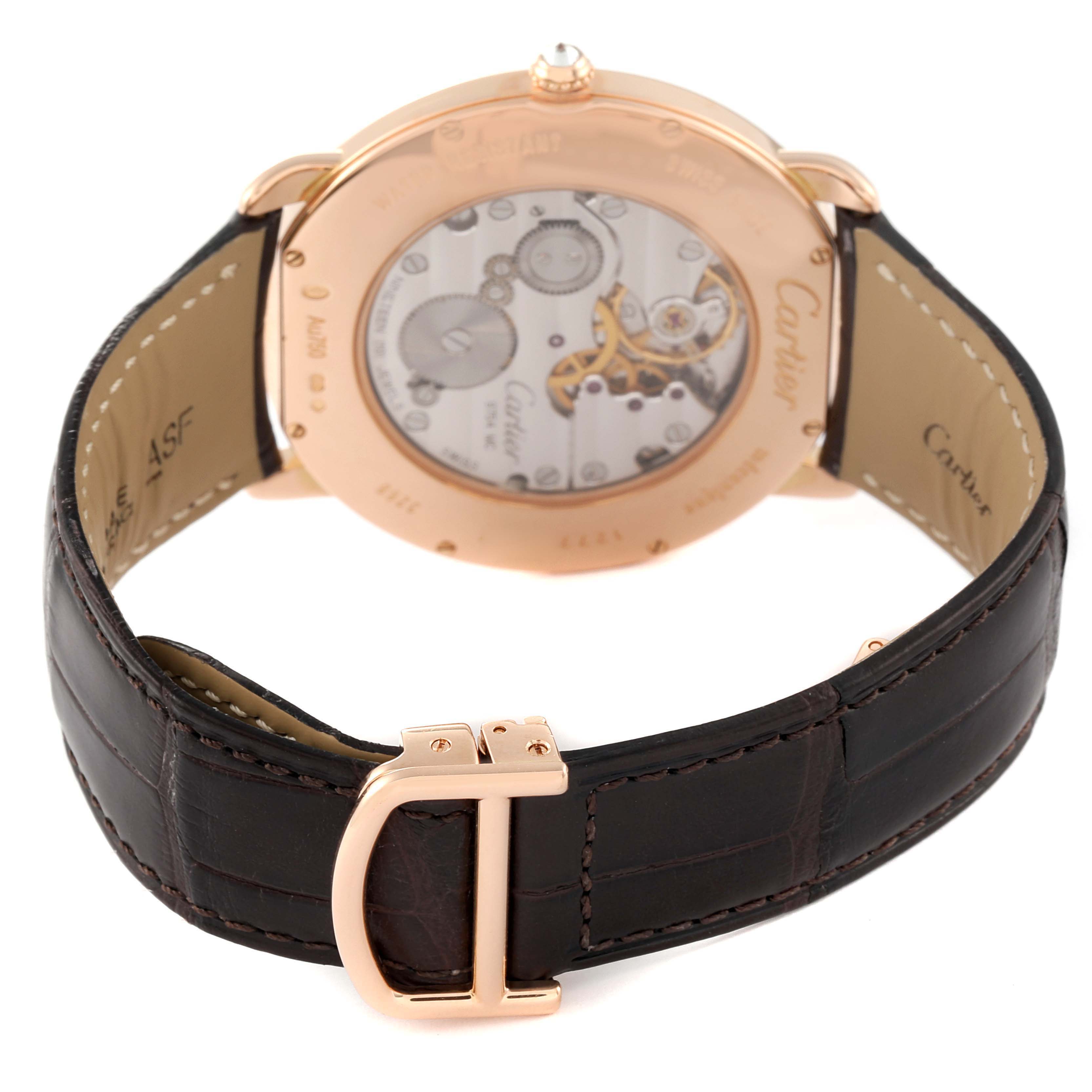 The Cartier Ronde WR007001 Men's Rose Gold Silver Dial watch is shown from the back angle, highlighting the movement and leather strap.