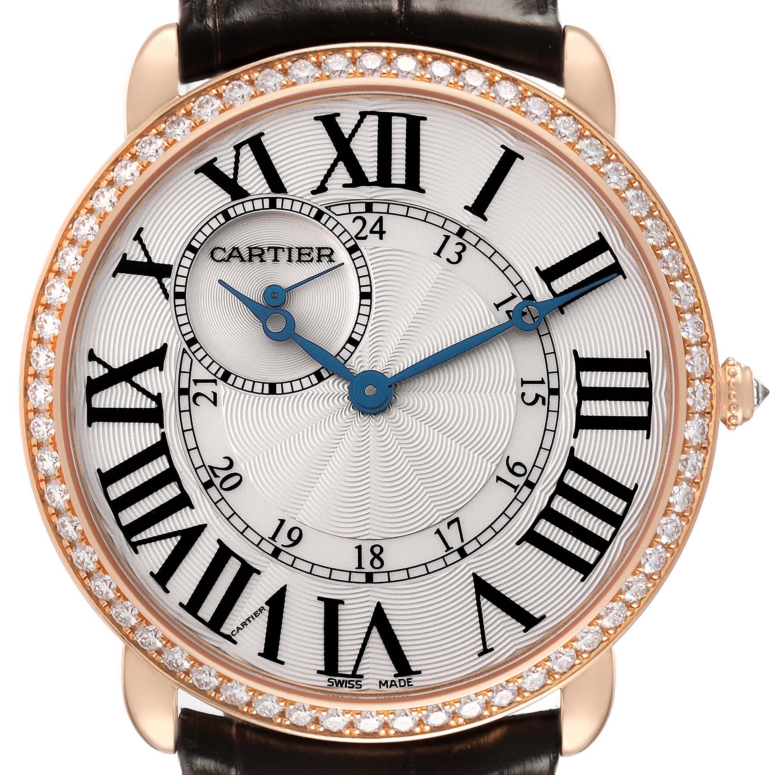 The Cartier Ronde WR007001 Men's Rose Gold Silver Dial watch is shown at a close-up angle, featuring a diamond-set bezel, blue hands, and Roman numerals on the dial.