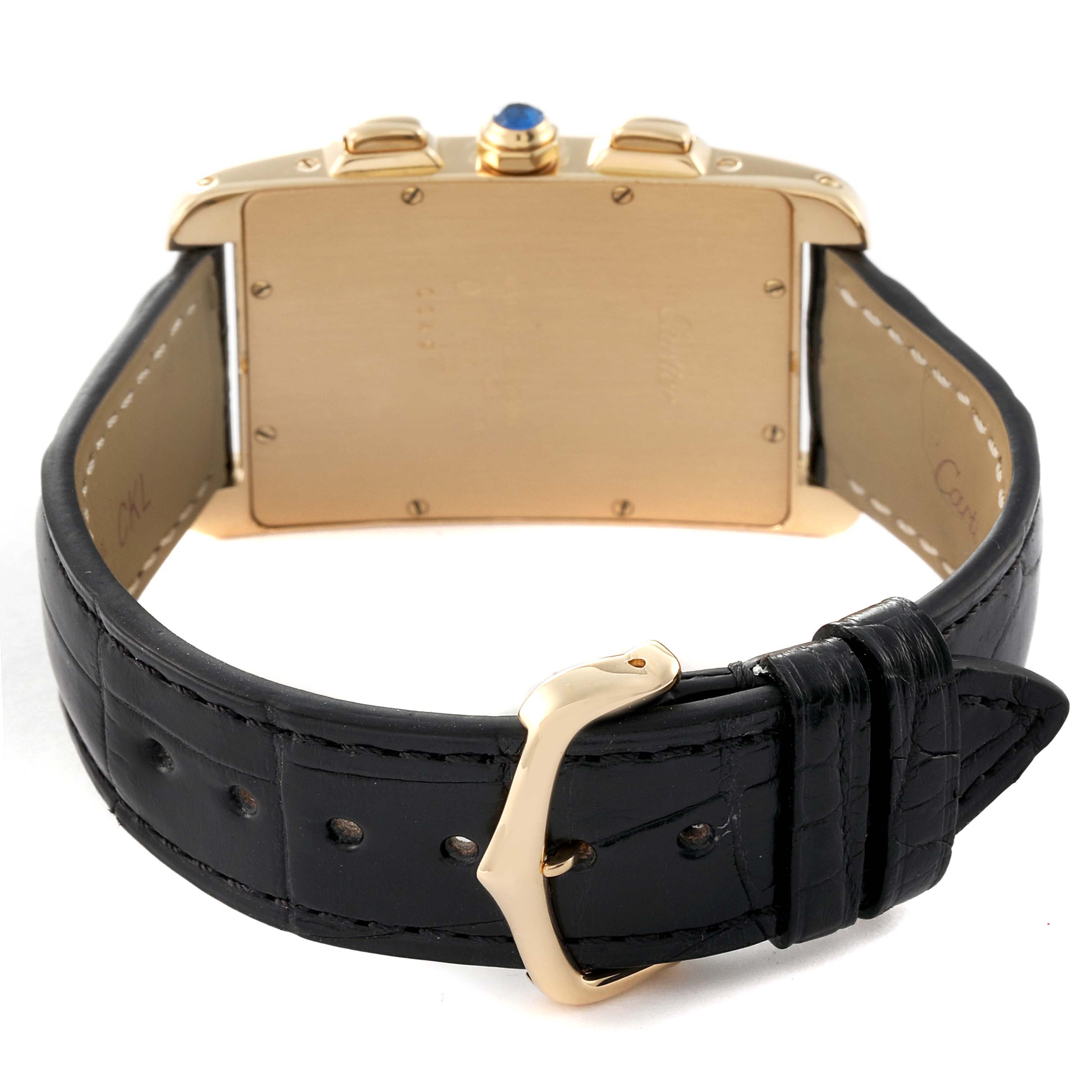 This image shows the back view of the Cartier Tank Americaine W2601156 Men
s Yellow Gold Silver Dial W2601156 Men
s Yellow Gold Silver Dial watch, highlighting its case, crown, and leather strap with a buckle.