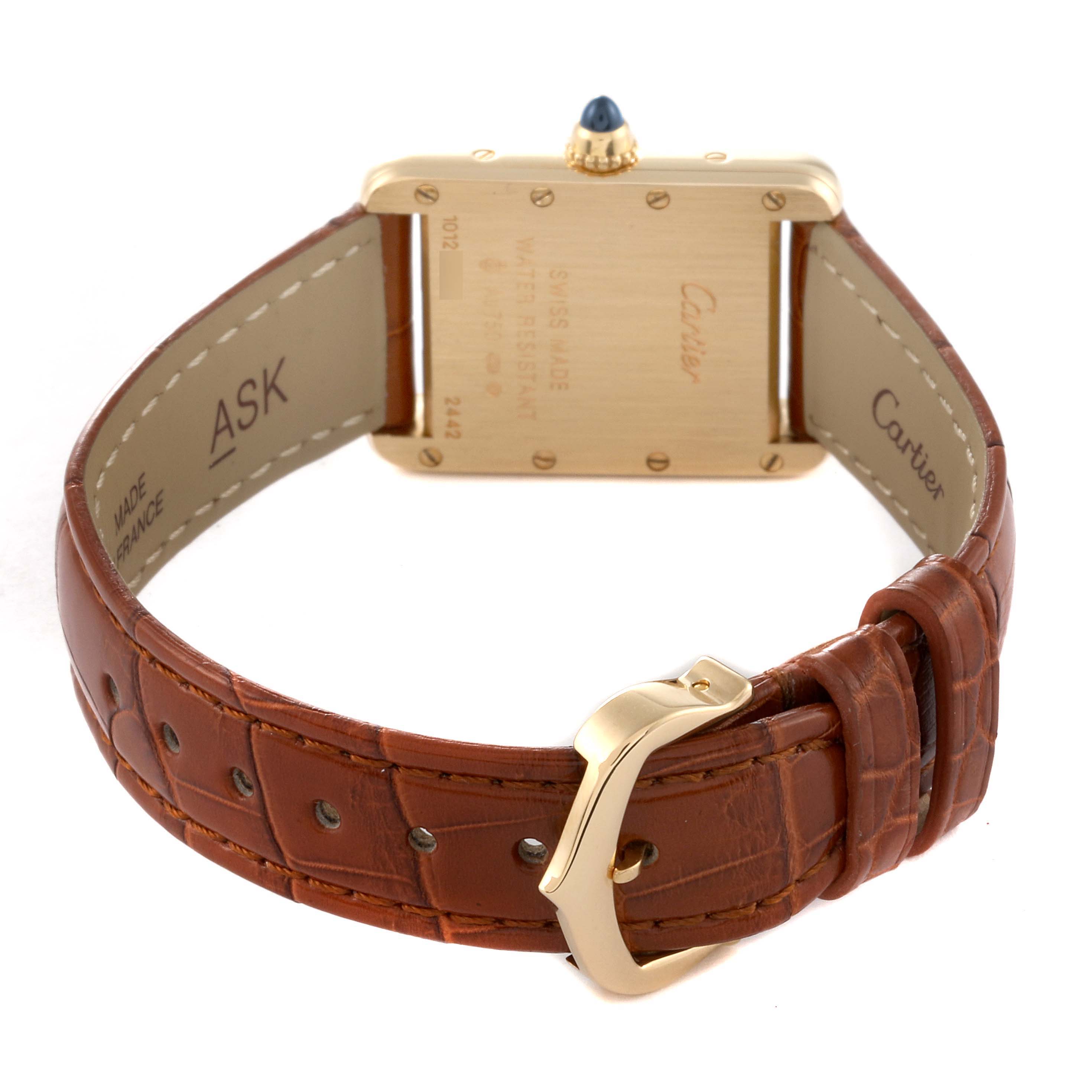 The image shows the back and buckle of the Cartier Tank Louis W1529856 Women
s Yellow Gold Silver Dial W1529856 Women
s Yellow Gold Silver Dial watch, highlighting the leather strap and caseback details.