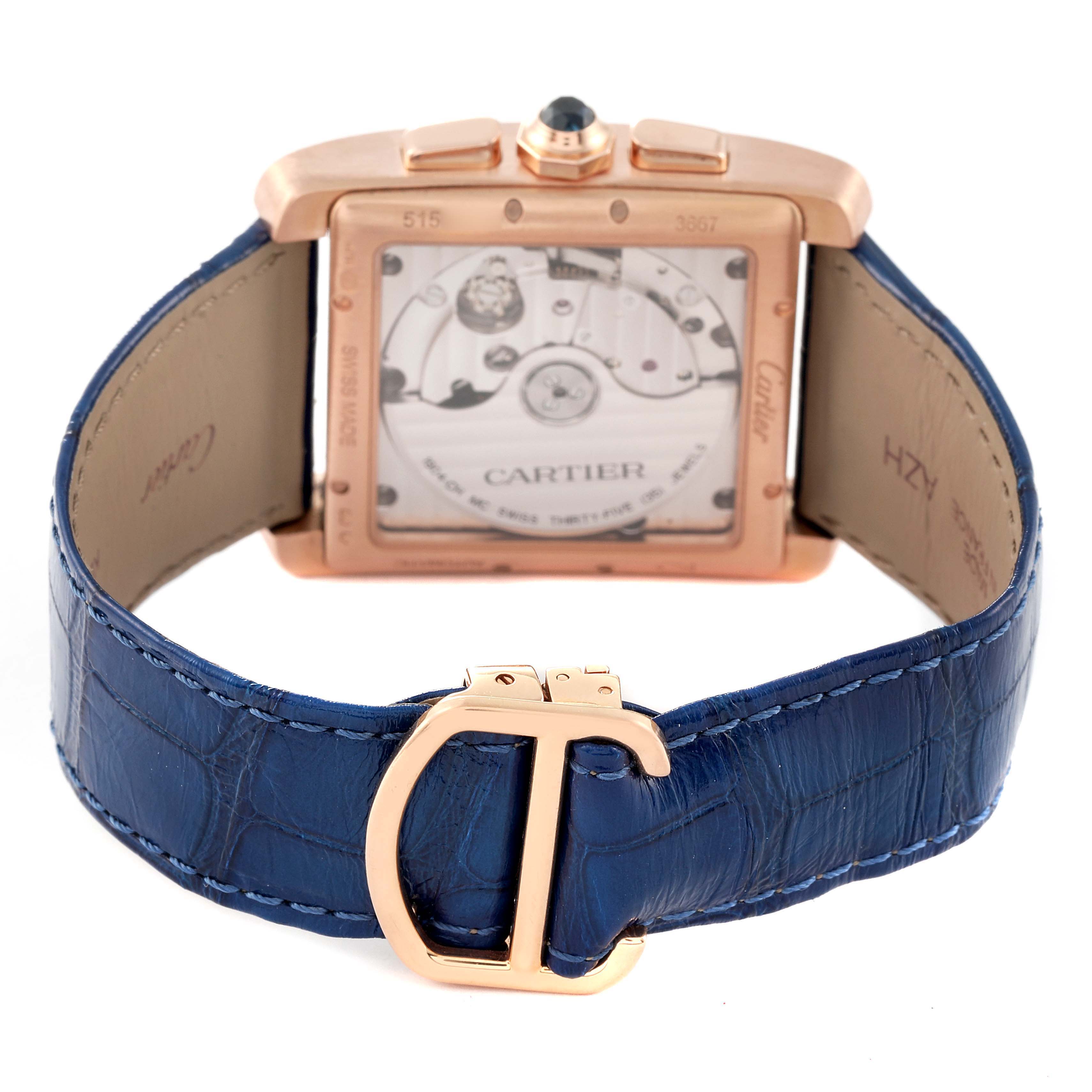 The image shows the back view of a Cartier Tank MC W5330005 Men's Rose Gold Silver Dial W5330005 Men's Rose Gold Silver Dial watch, displaying the movement and a blue leather strap with a gold clasp.