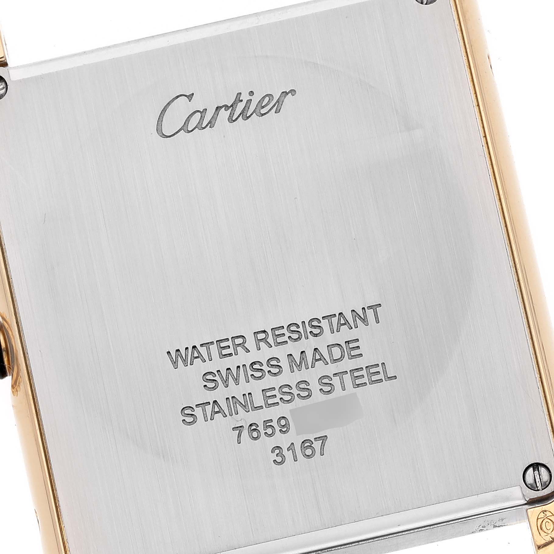 The image shows the back case of a Cartier Tank Solo W5200004 Men
s Yellow Gold Silver Dial W5200004 Men
s Yellow Gold Silver Dial watch, focusing on its inscriptions and materials.