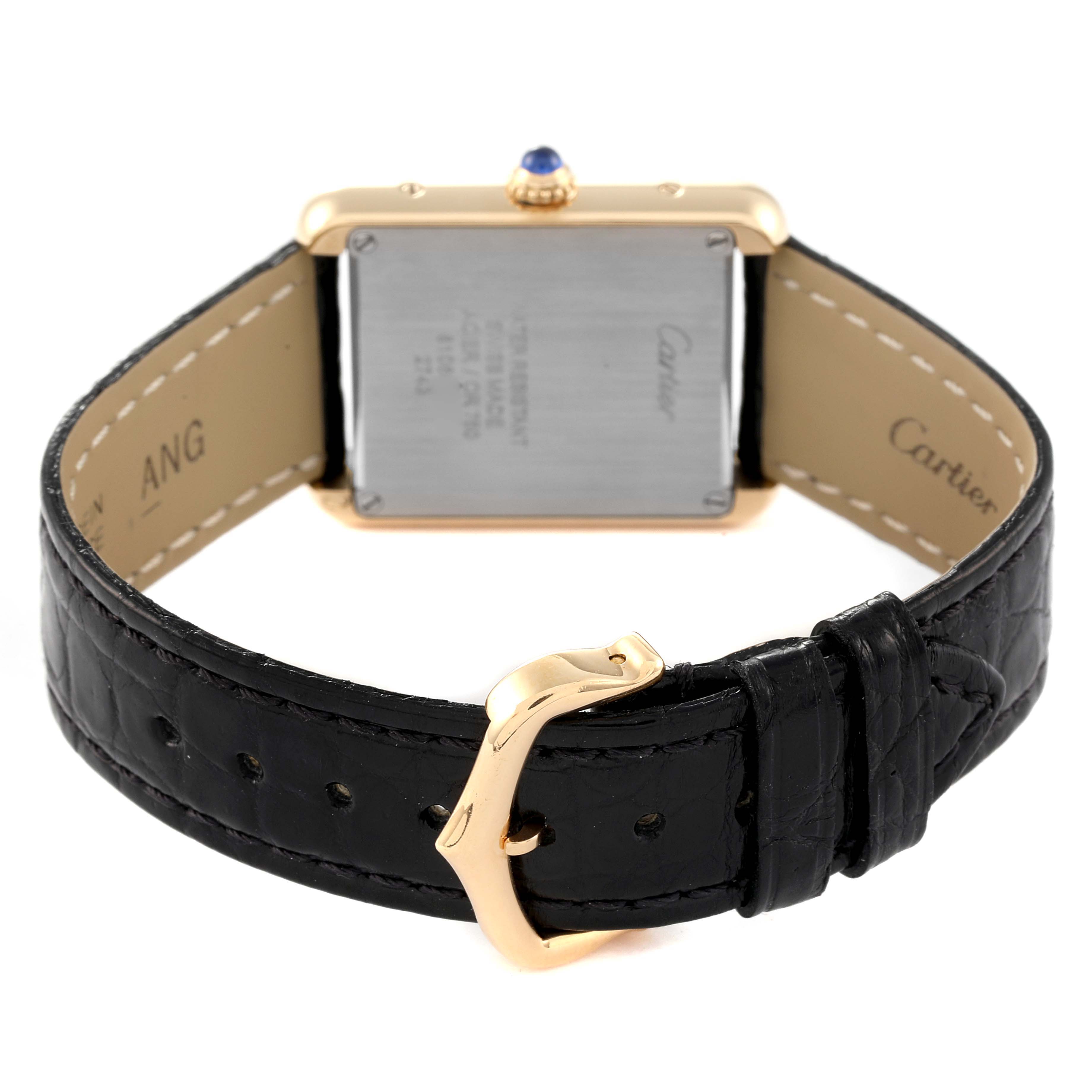 The image shows the back of a Cartier Tank Solo W1018755 Women's Yellow Gold Silver Dial W1018755 Women's Yellow Gold Silver Dial watch and its black leather strap with a gold buckle.