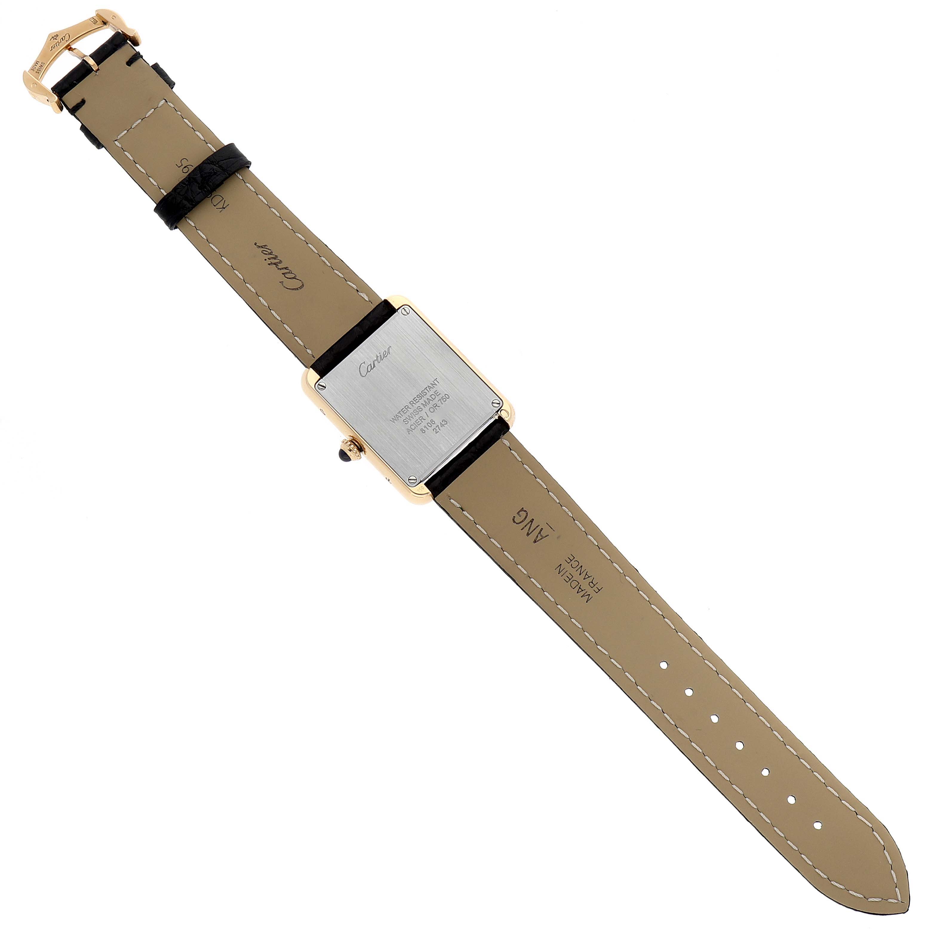 The image shows the back view of a Cartier Tank Solo W1018755 Women's Yellow Gold Silver Dial W1018755 Women's Yellow Gold Silver Dial watch including its leather strap and case back.