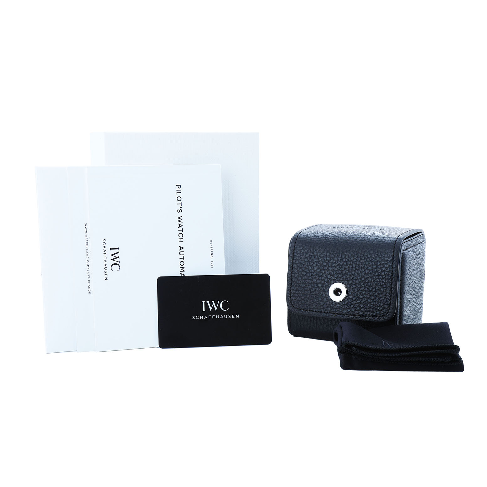 The image shows IWC Pilot IW328203 Men's Stainless Steel Blue Dial model watch accessories, including a booklet, warranty card, leather case, and cleaning cloth.