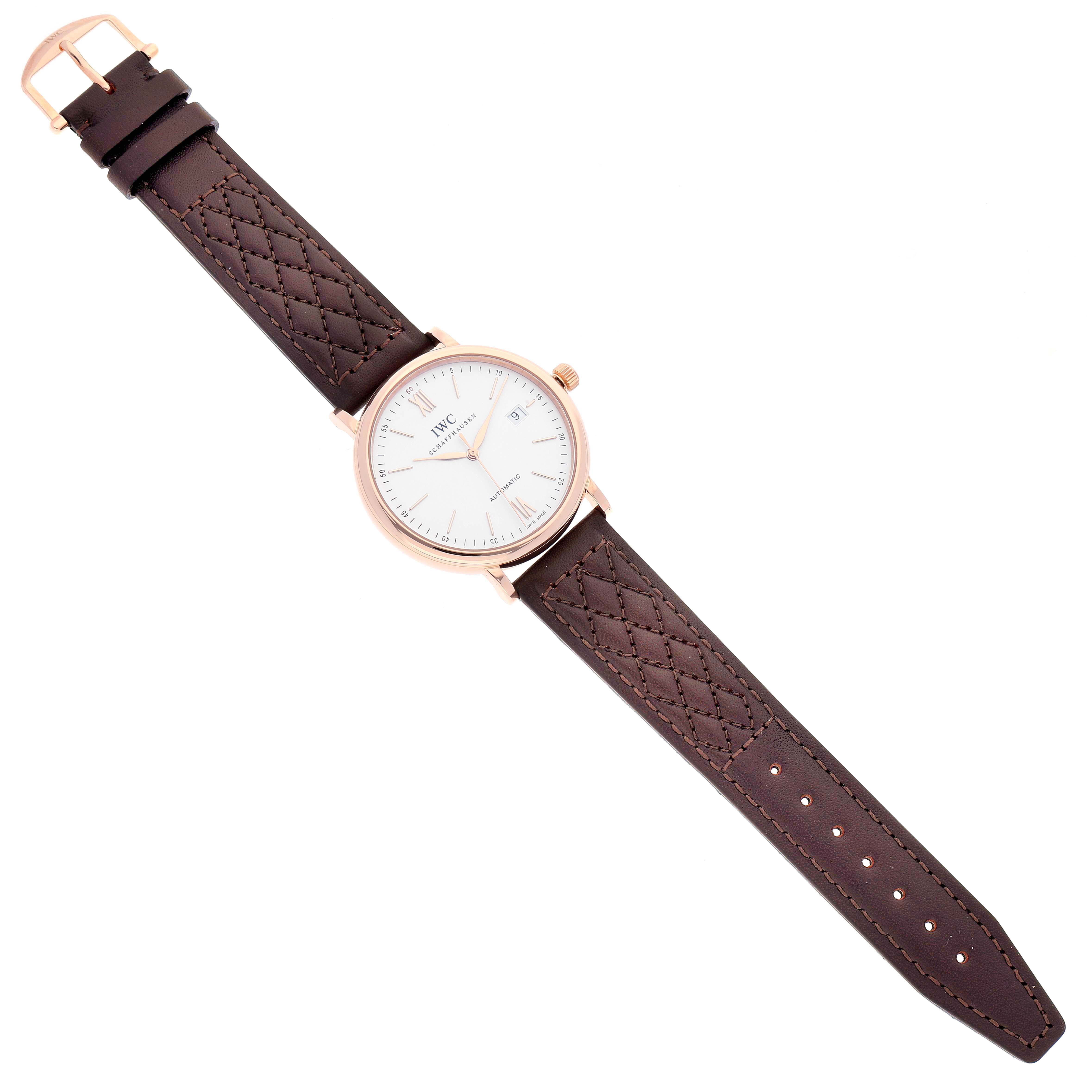 The image shows a top-down view of an IWC Portofino IW356504 Men's Rose Gold Silver Dial IW356504 Men's Rose Gold Silver Dial watch, featuring a brown leather strap and a white dial.
