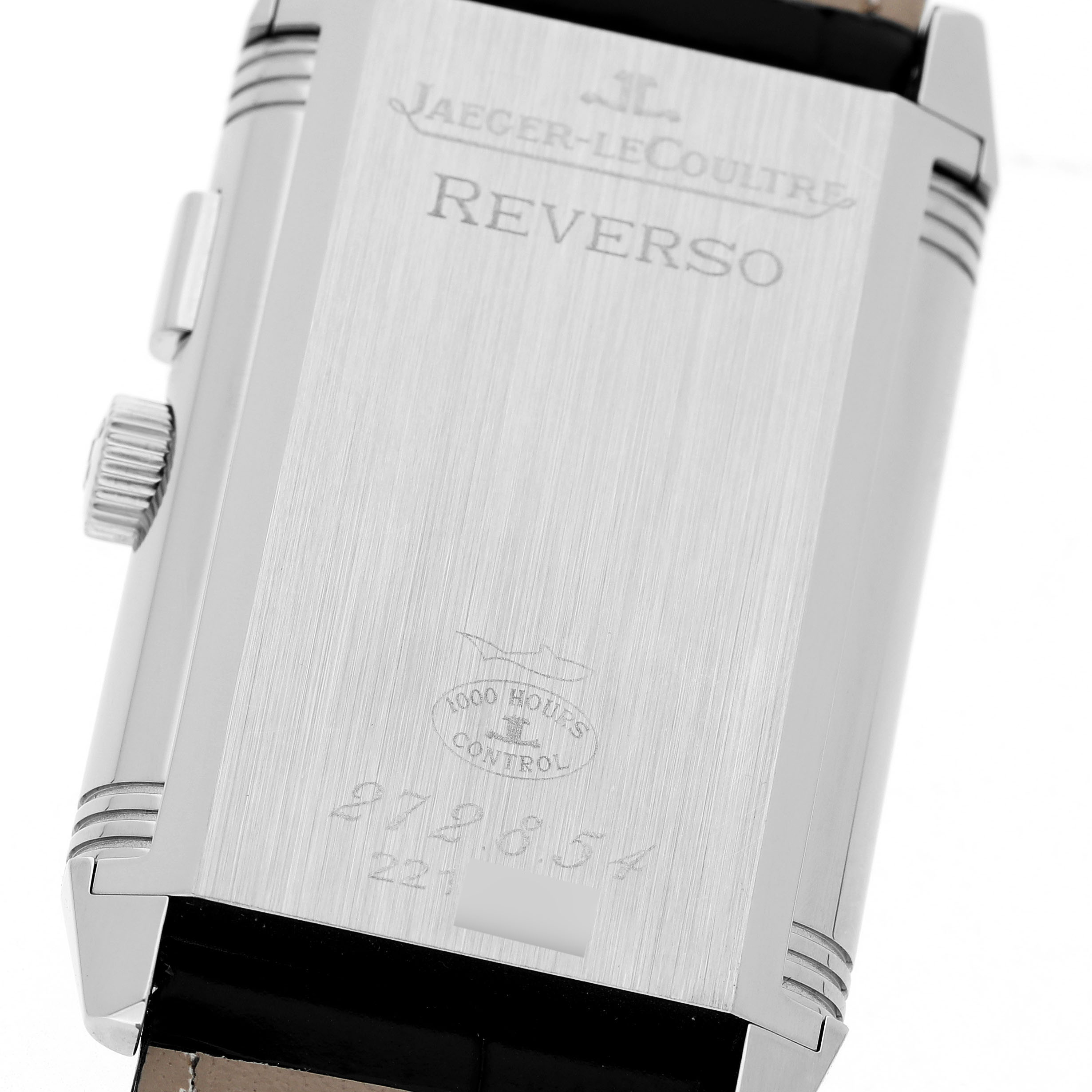 The image shows the back of a Jaeger LeCoultre Reverso Q2718410 Men's Stainless Steel Silver Dial watch, highlighting its brushed metal surface and engravings.