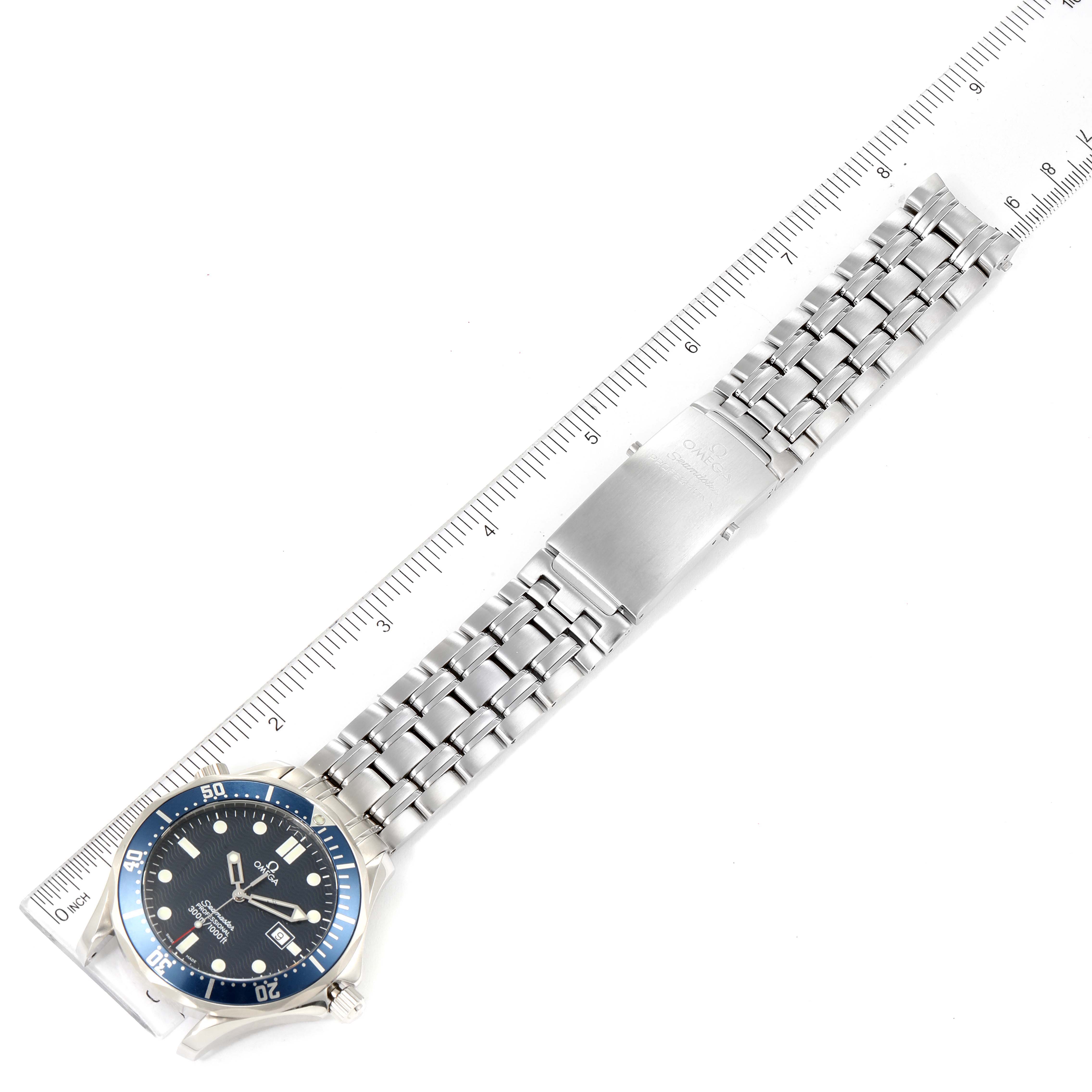 The Omega Seamaster 2541.80.00 Men's Stainless Steel Blue Dial 2541.80.00 Men's Stainless Steel Blue Dial watch is shown laying flat with the face and stainless steel bracelet fully visible next to a ruler.