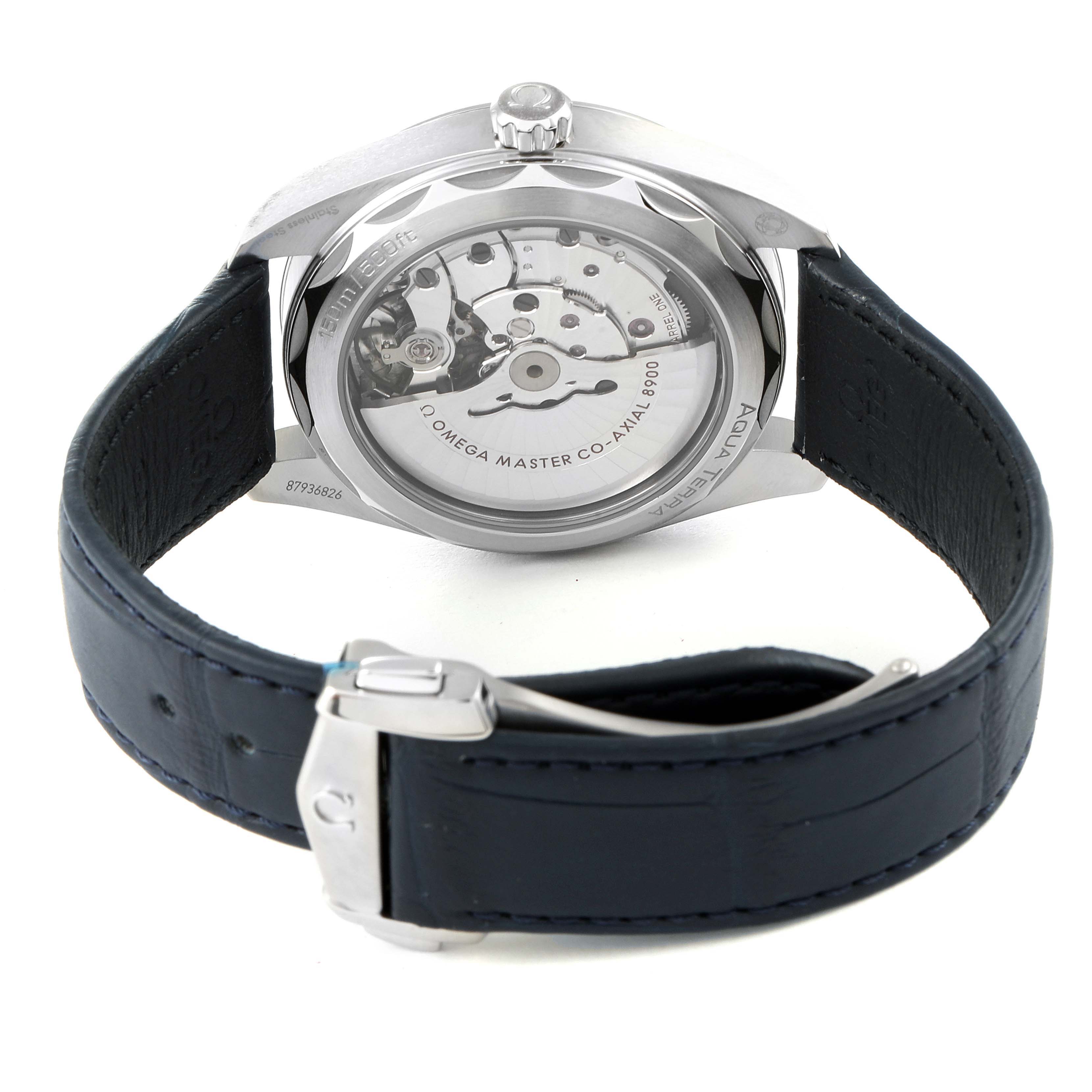 The image shows the back view of an Omega Aqua Terra 220.13.41.21.03.001 Men's Stainless Steel Blue Dial 220.13.41.21.03.001 Men's Stainless Steel Blue Dial watch, focusing on the open case back and leather strap.