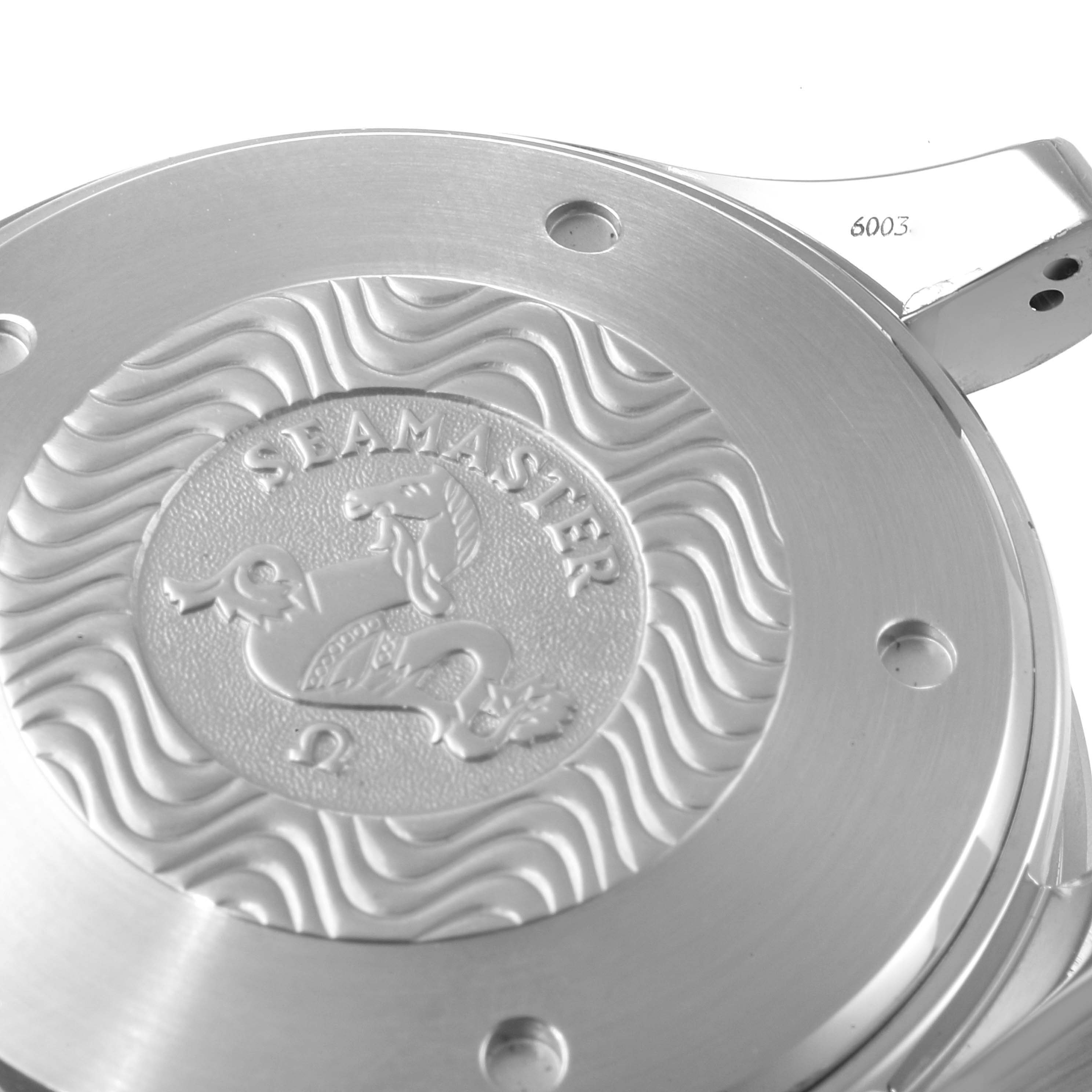 The image shows the case back of an Omega Seamaster 2599.80.00 Men's Stainless Steel Blue Dial 2599.80.00 Men's Stainless Steel Blue Dial watch, highlighting its embossed design and wave patterns.