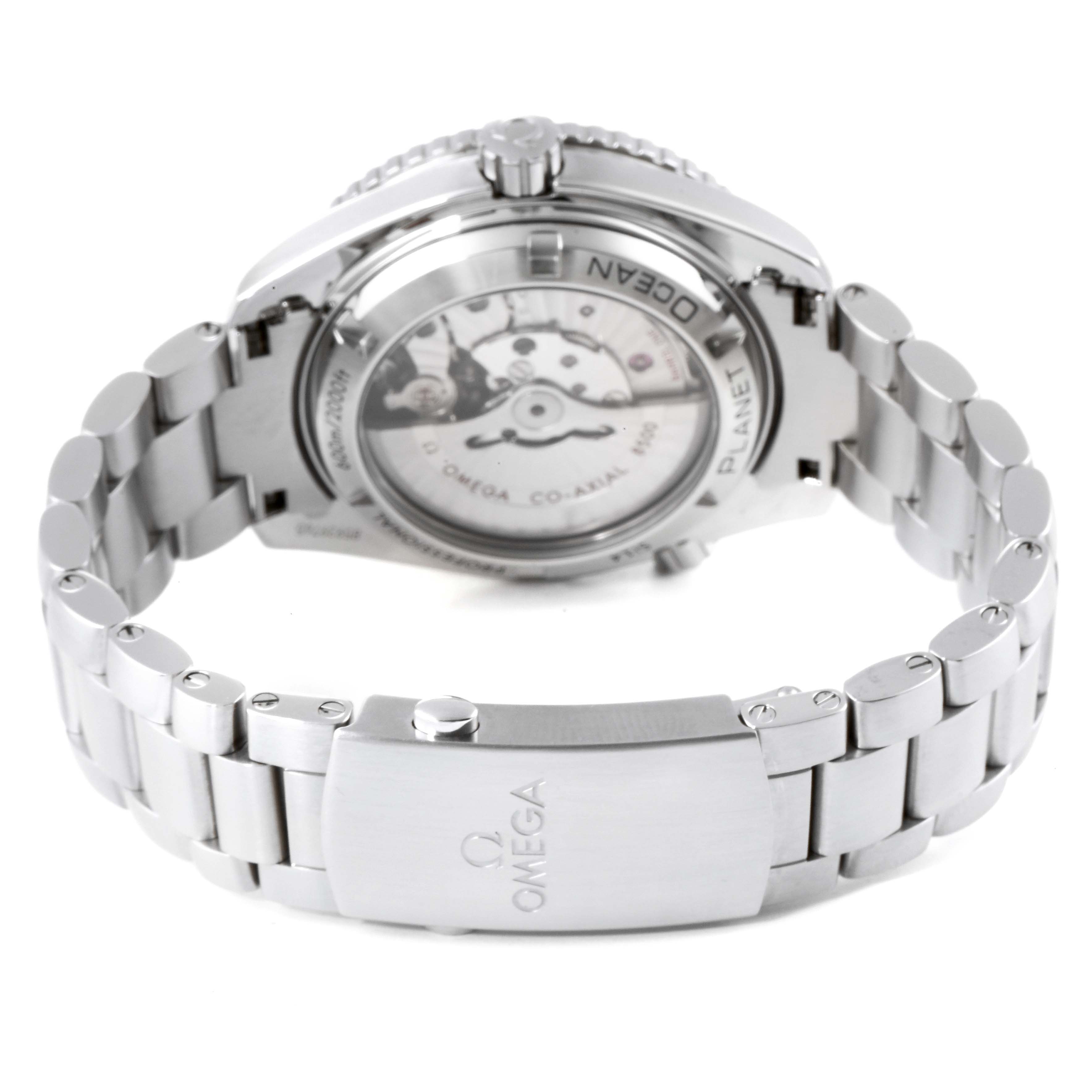 The image shows the back view of an Omega Planet Ocean 232.30.42.21.01.002 Men
s Stainless Steel Black Dial 232.30.42.21.01.002 Men
s Stainless Steel Black Dial watch, highlighting its metal bracelet and transparent case back.