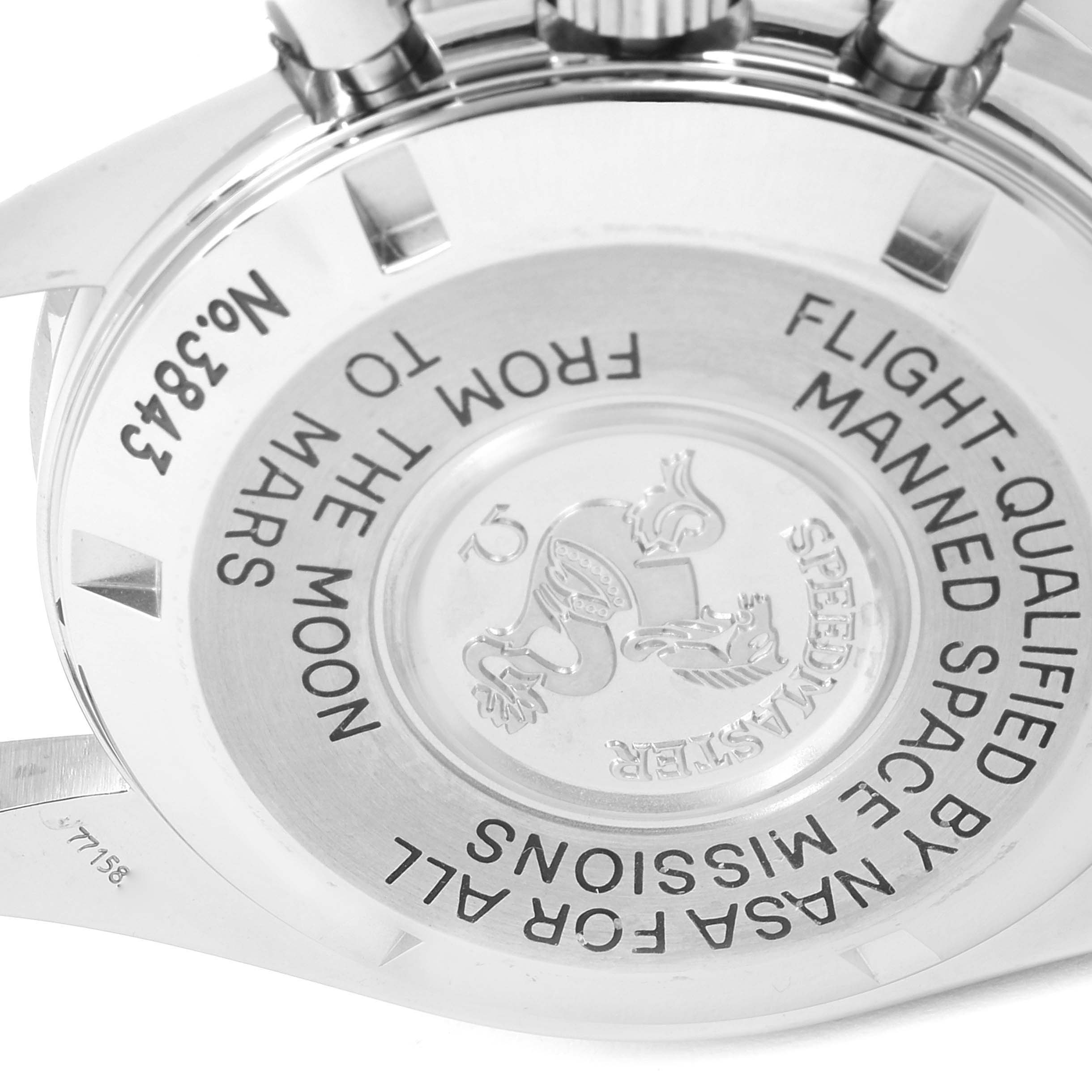This image shows the back case of an Omega Speedmaster 3577.50.00 Men's Stainless Steel Black Dial 3577.50.00 Men's Stainless Steel Black Dial watch, highlighting engraving details.