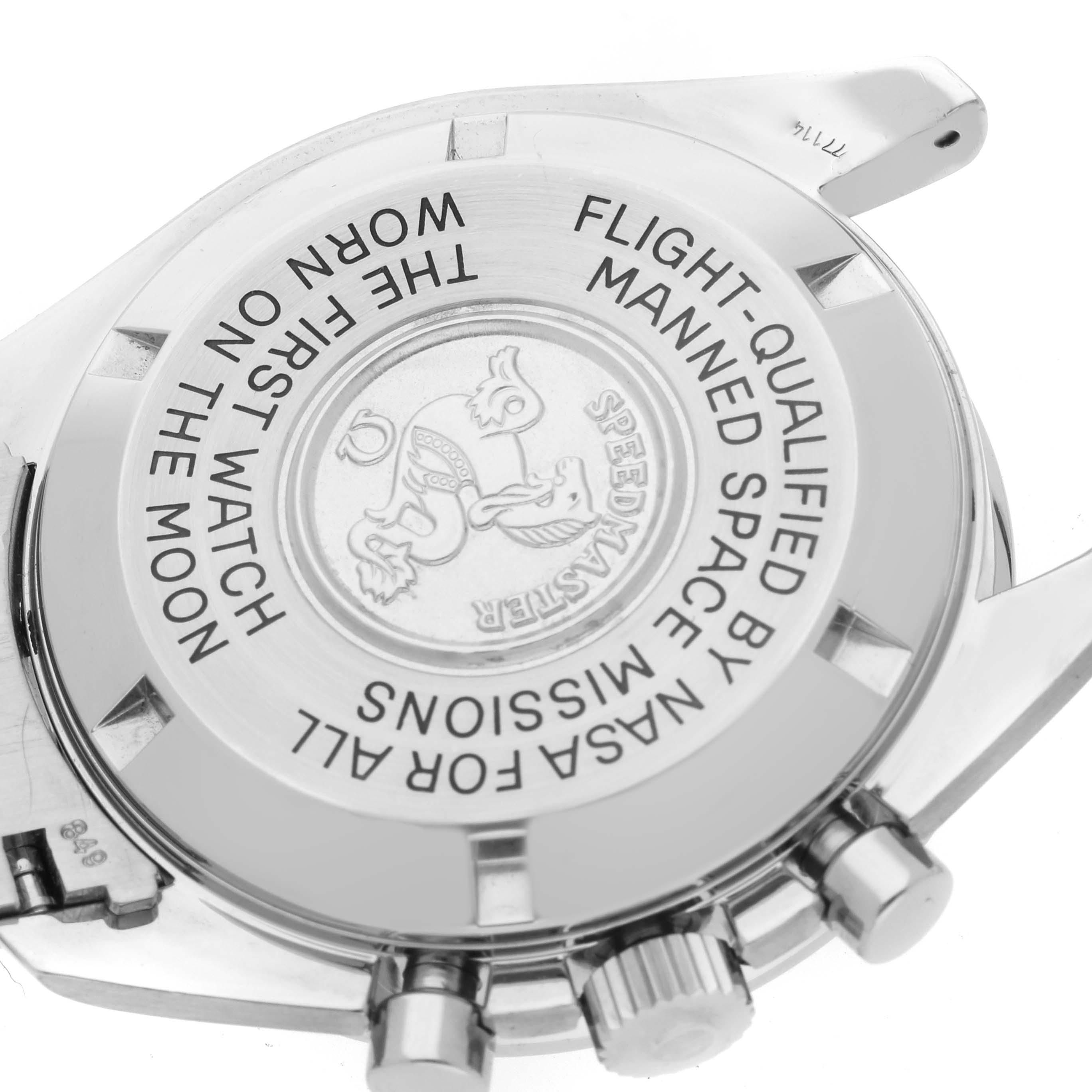 The image shows the case back and side buttons of an Omega Speedmaster 3570.50.00 Men
s Stainless Steel Black Dial 3570.50.00 Men
s Stainless Steel Black Dial watch, highlighting its engraved text and emblem.