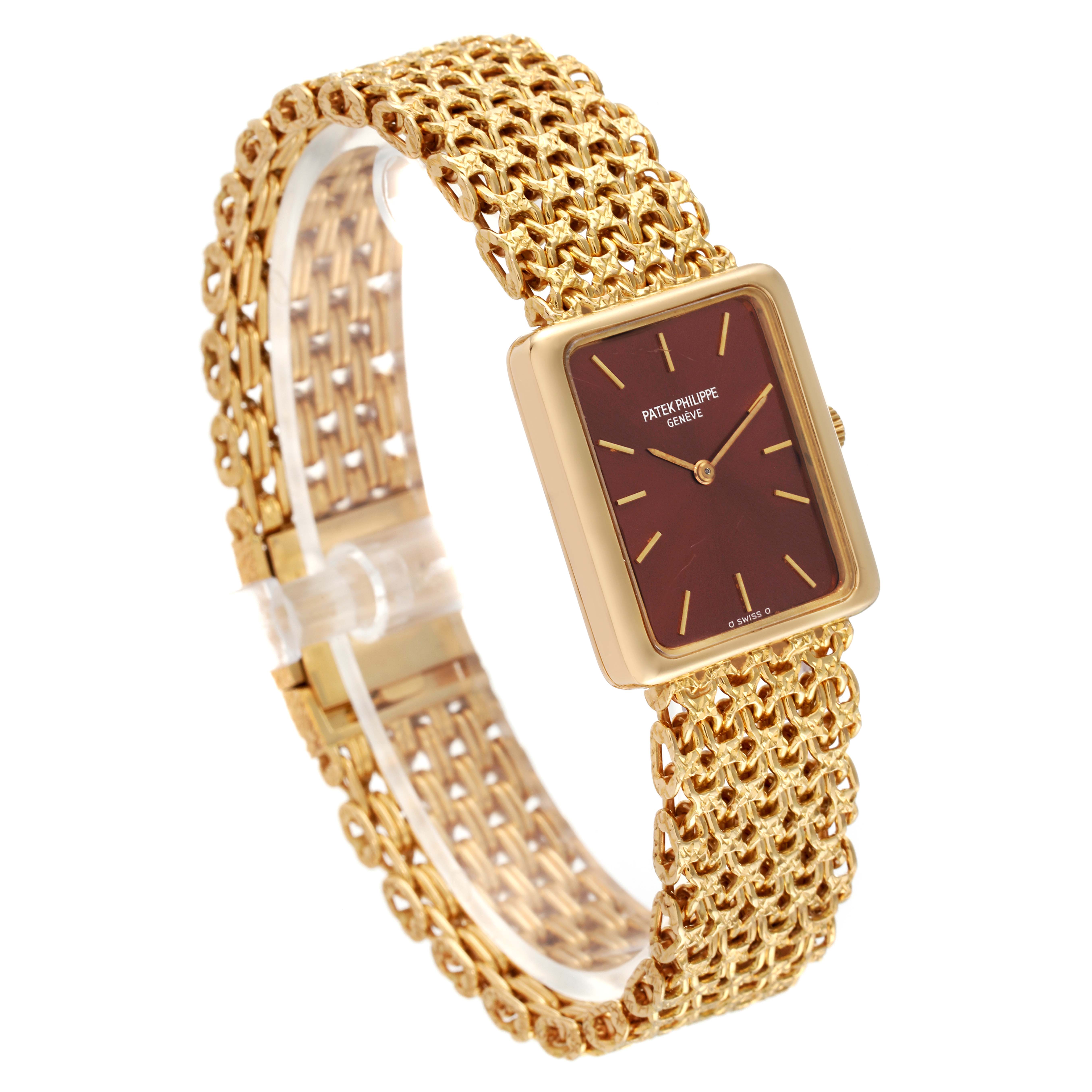 The image shows a Patek Philippe Gondolo 4224 - 1 Women's Yellow Gold Brown Dial 4224 - 1 Women's Yellow Gold Brown Dial watch at a three-quarter angle, highlighting its gold mesh band and rectangular face.